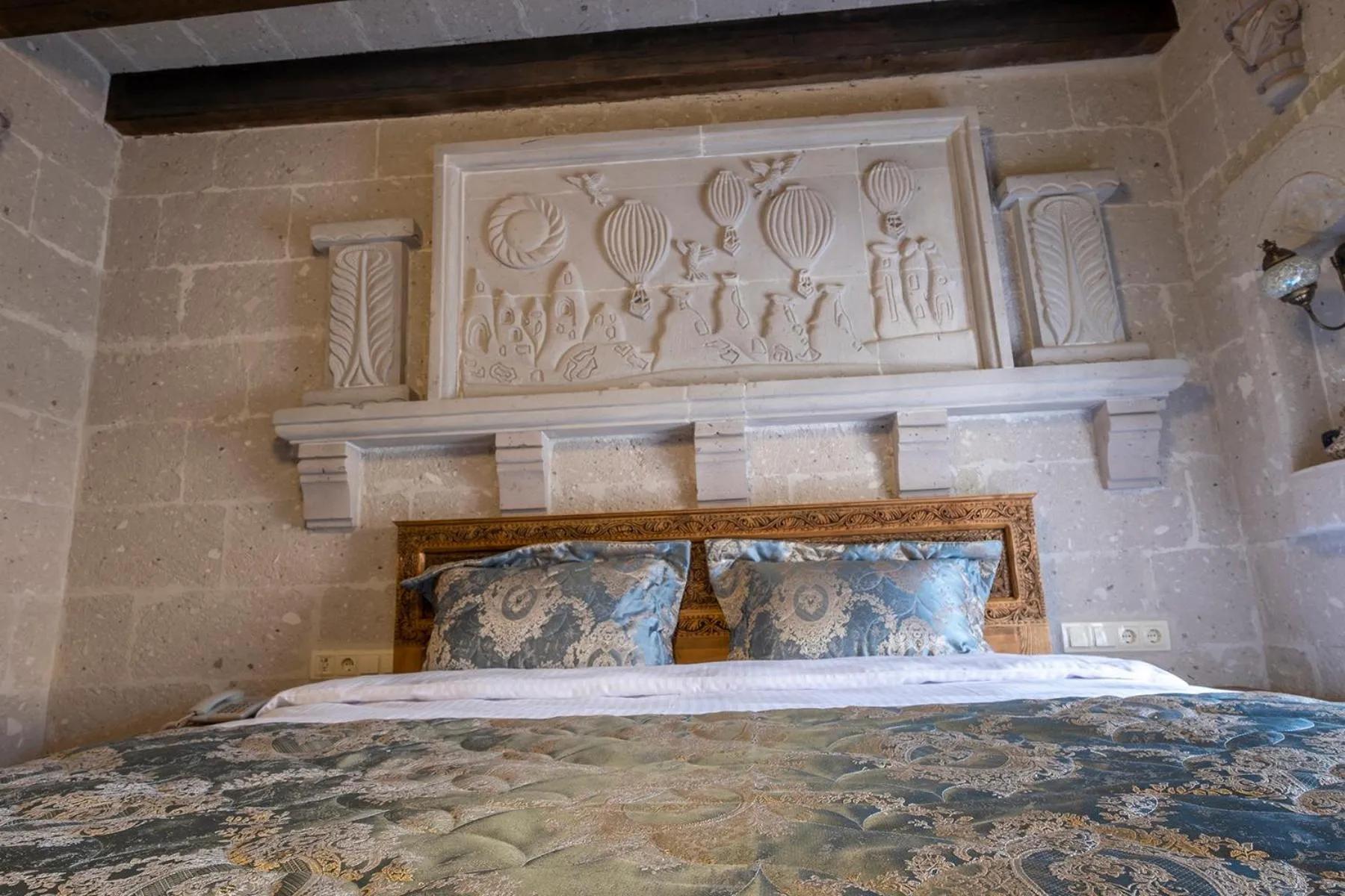 Bed in Underground Cave Suites Hotel