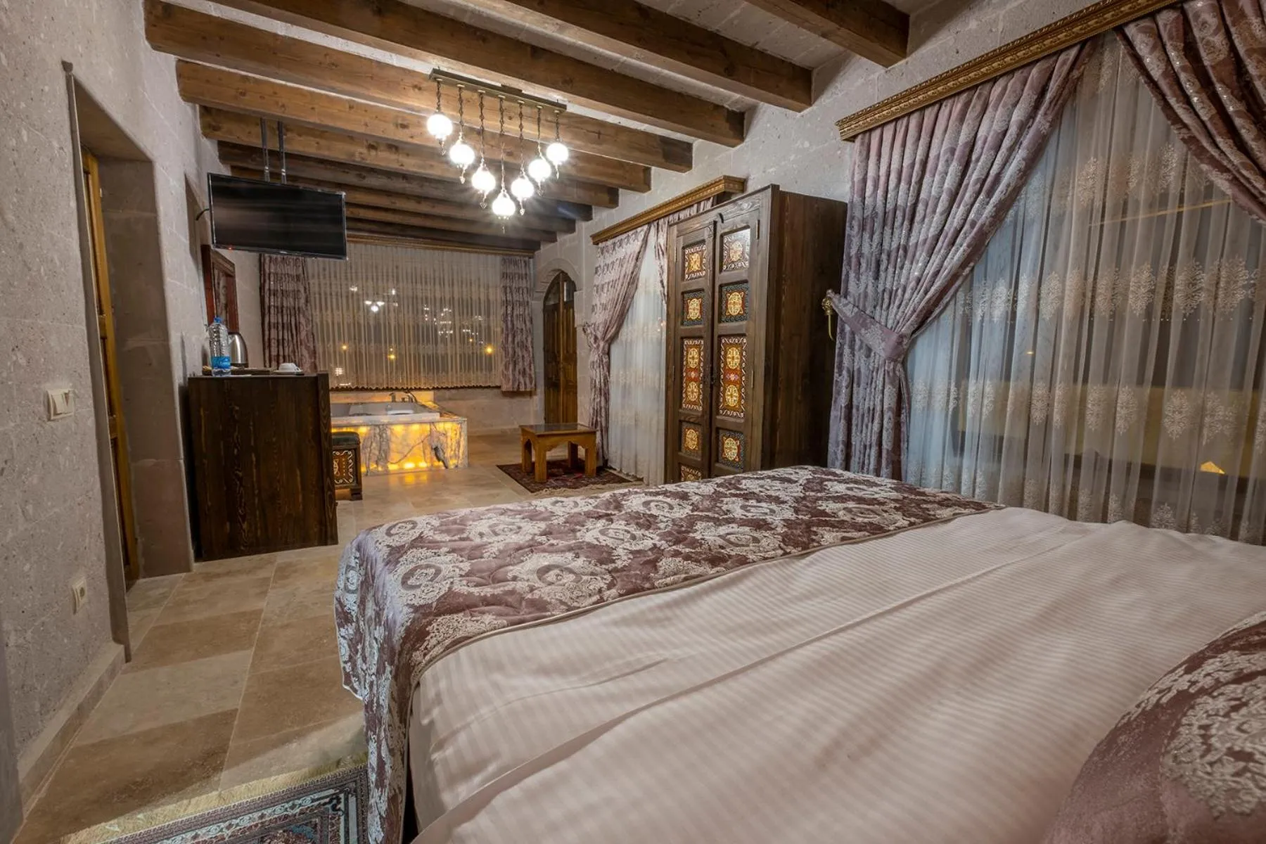 Bed in Underground Cave Suites Hotel