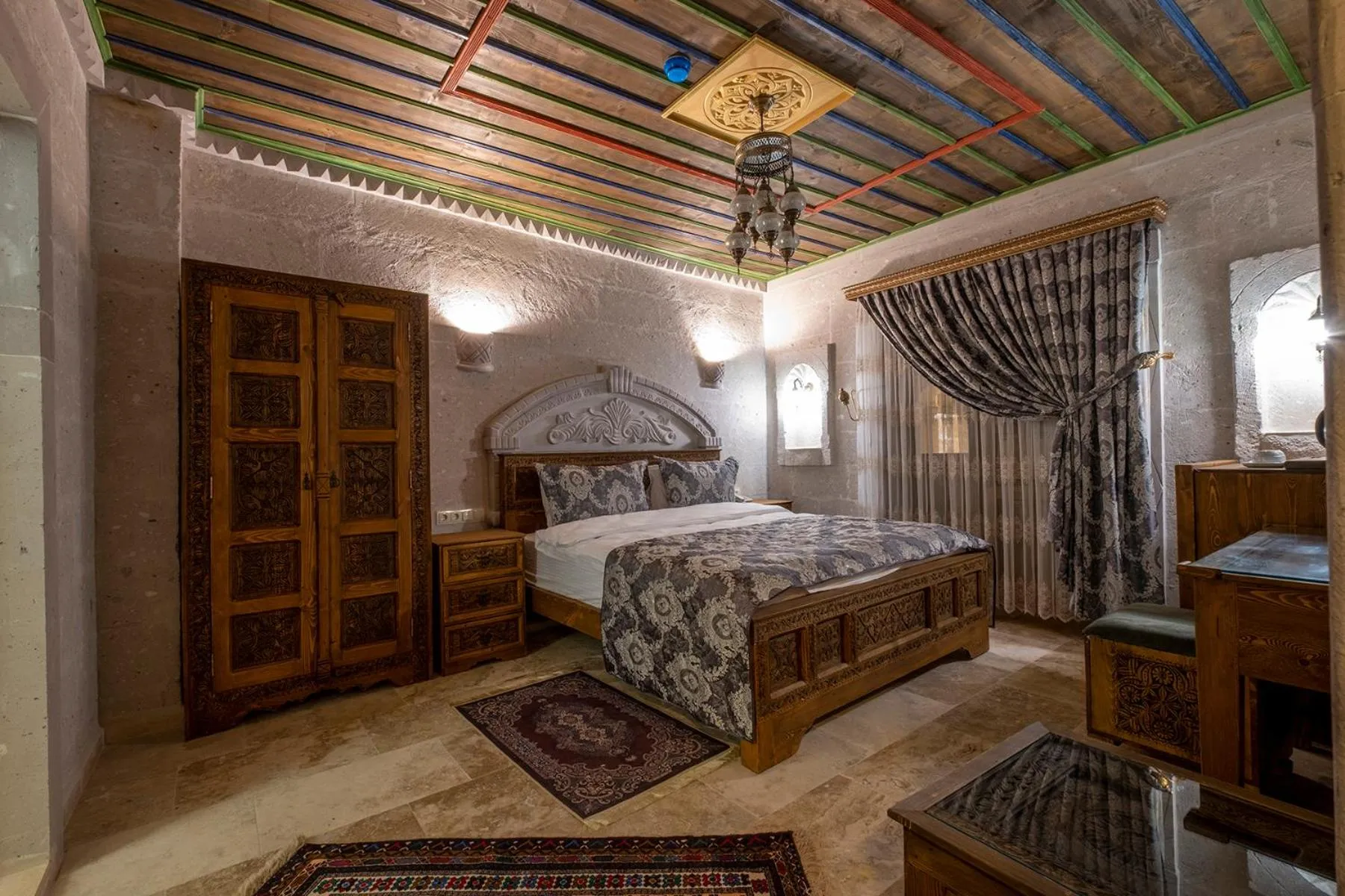 Bed in Underground Cave Suites Hotel