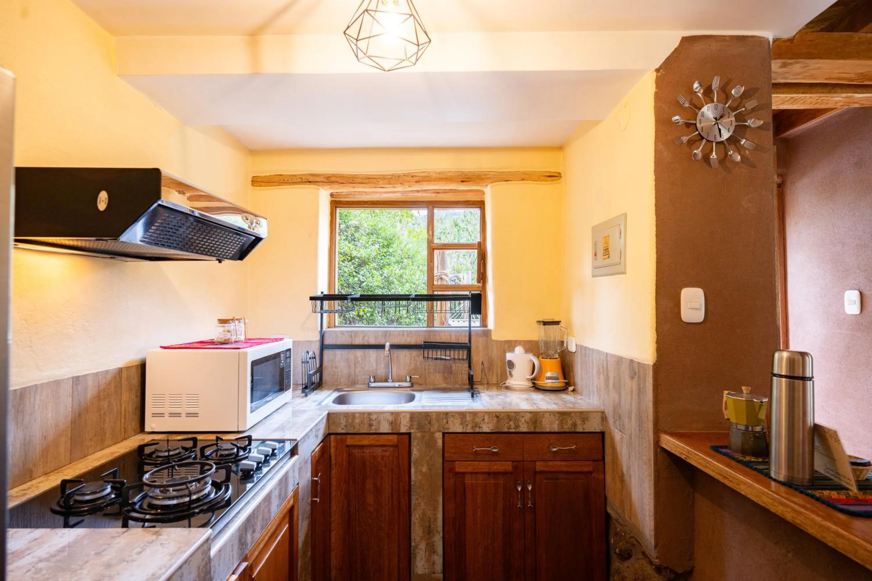 Kitchen or kitchenette in Unuwasi Hotel & Villa