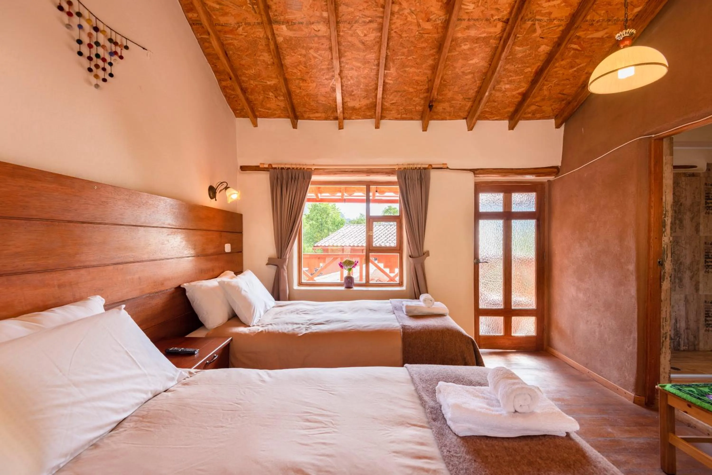 Photo of the whole room, Bed in Unuwasi Hotel & Villa