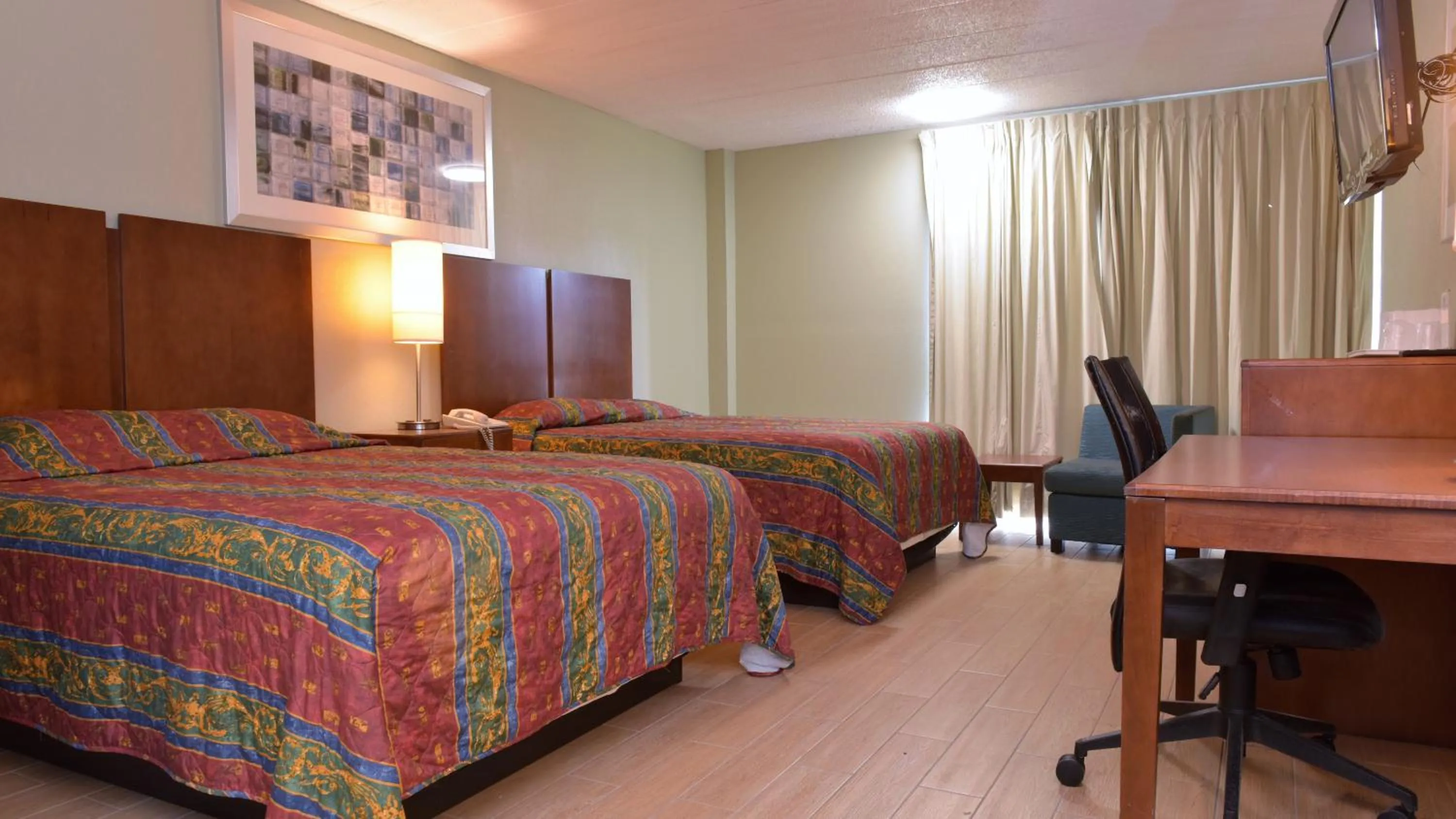 Bed in Red Carpet Inn