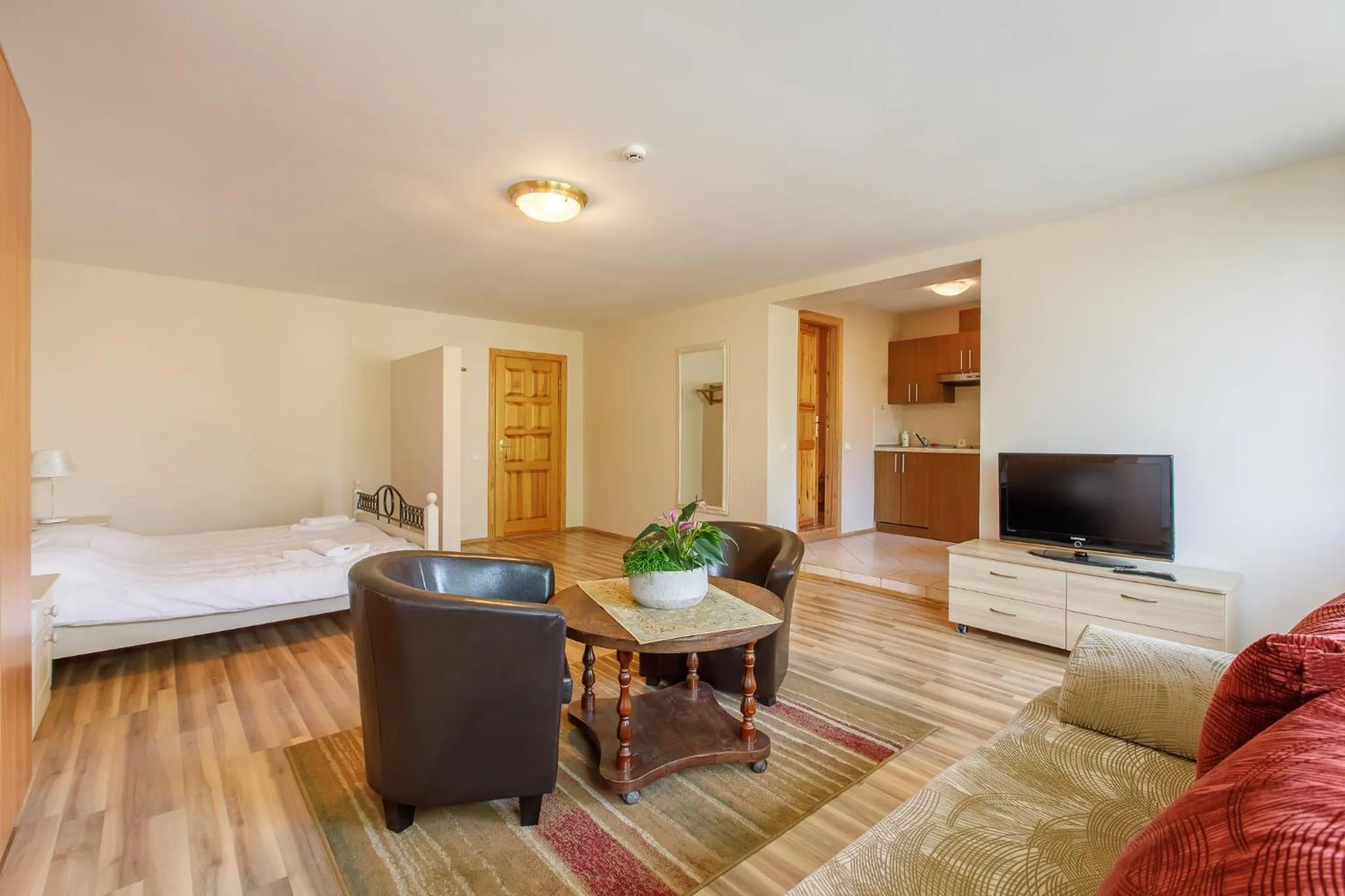 Seating area, Bed in Viešbutis Prie Fontano