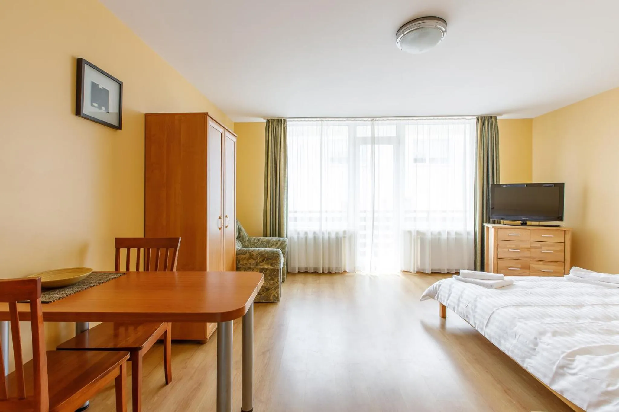 Seating area, Bed in Viešbutis Prie Fontano