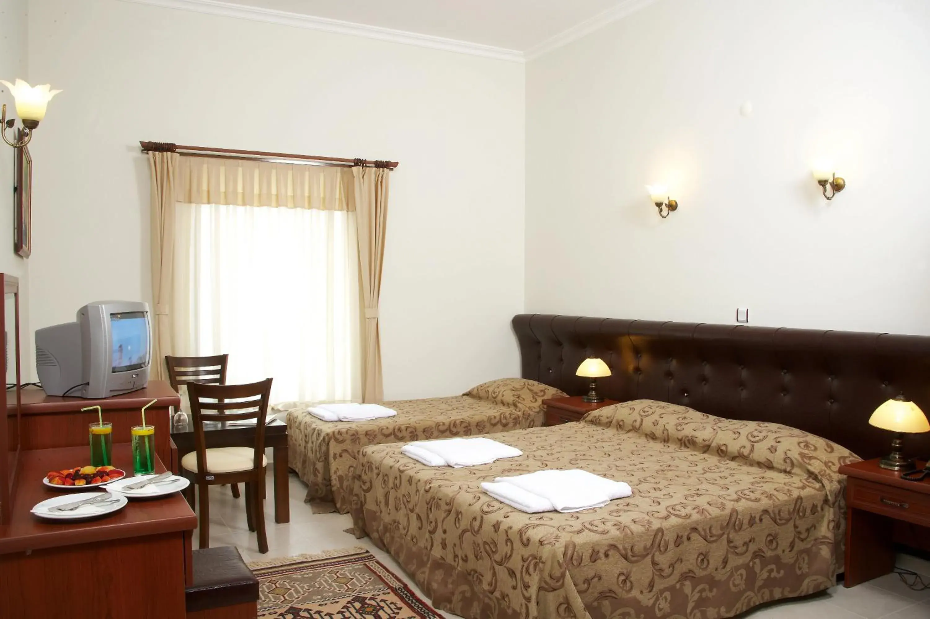 Standard Triple Room in Bacahan Hotel Standard Triple Room in Bacahan Hotel