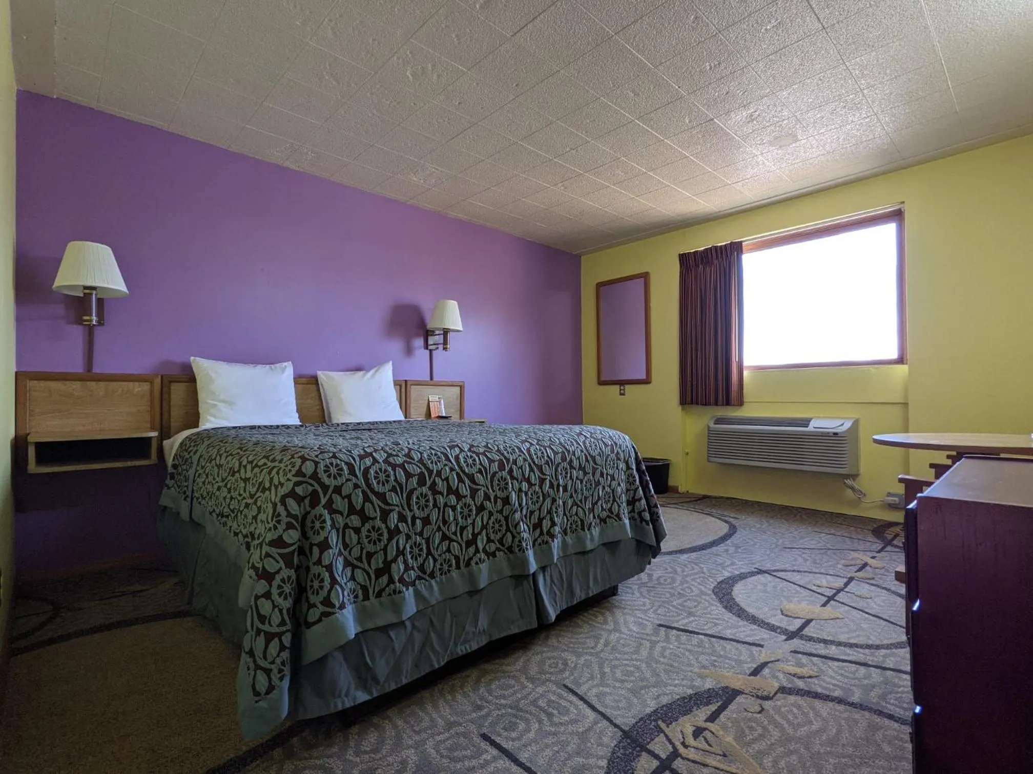 Bed in Great Plains Budget Inn
