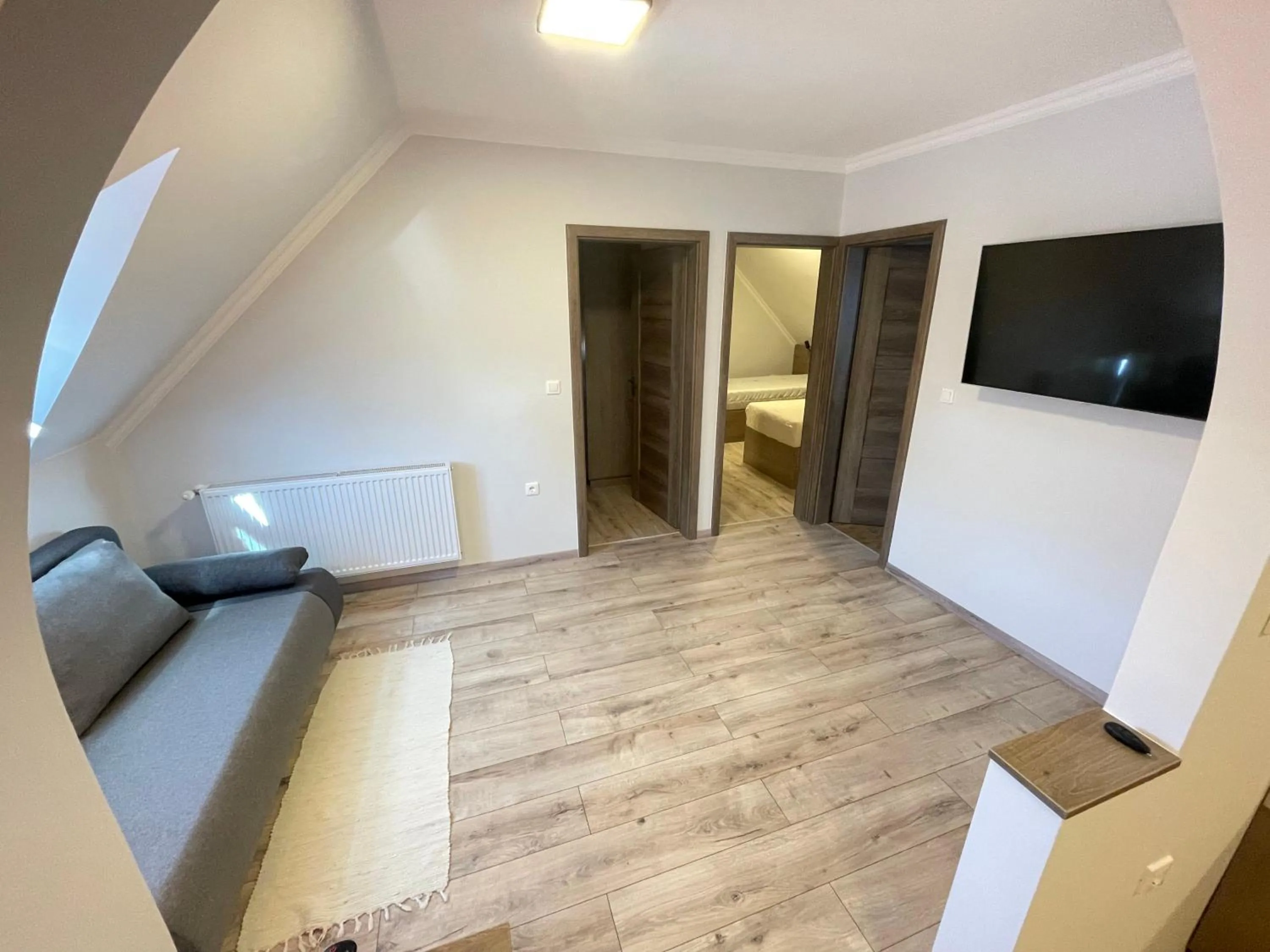 Communal lounge/ TV room in Kukorica Csárda Apartman