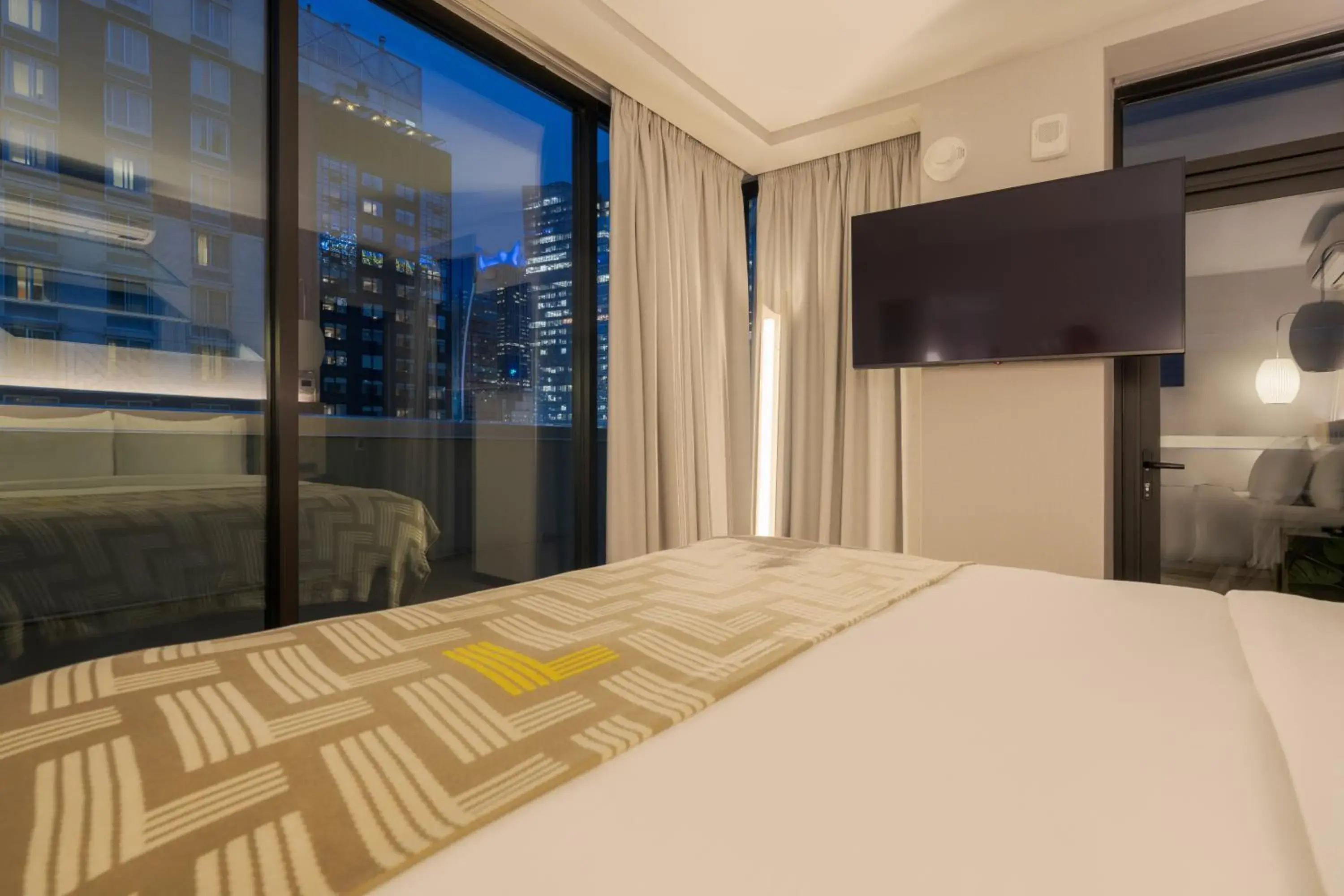 View (from property/room), Bed in Pestana CR7 Times Square View (from property/room), Bed in Pestana CR7 Times Square