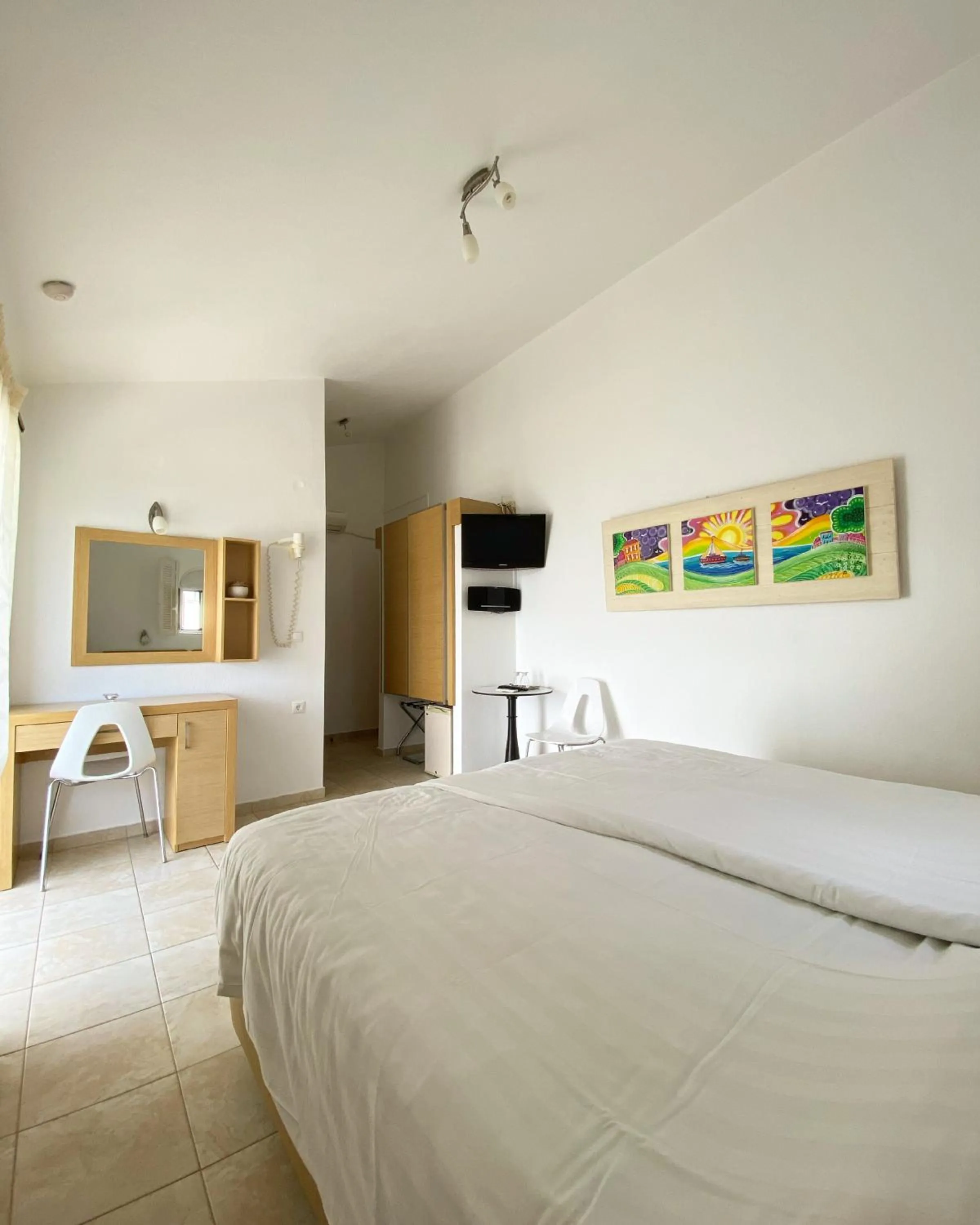 Bed in Anemoni Beach Hotel