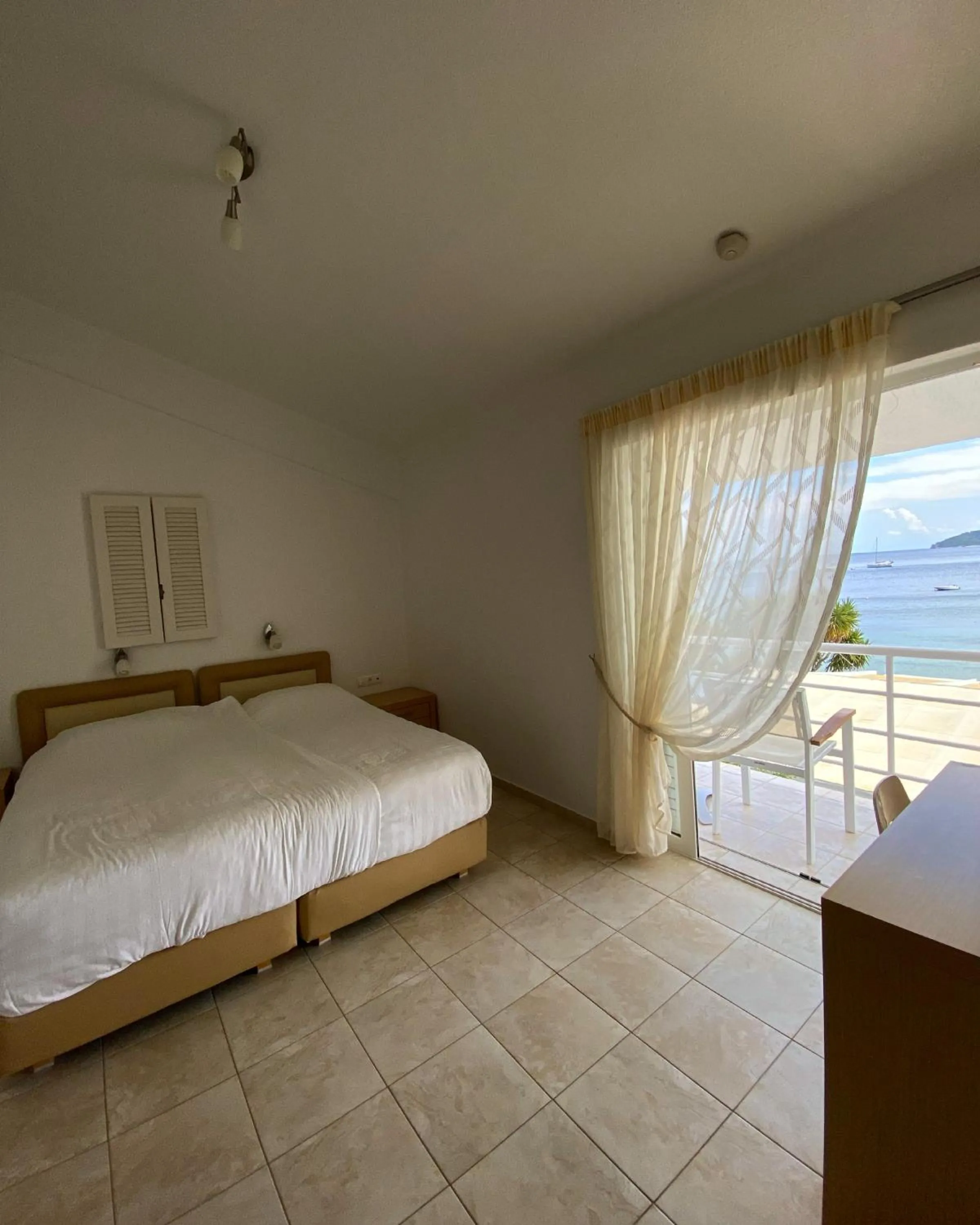 Bed in Anemoni Beach Hotel