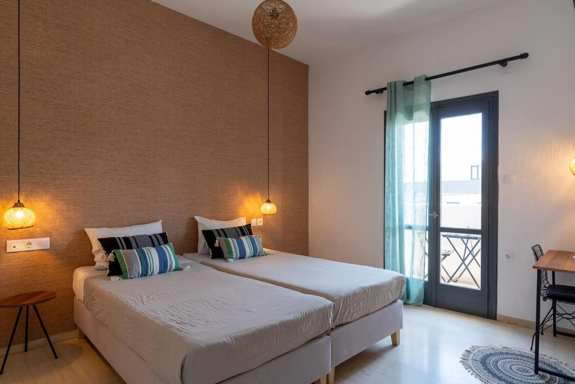 Bed in Anemos Inn by Estia