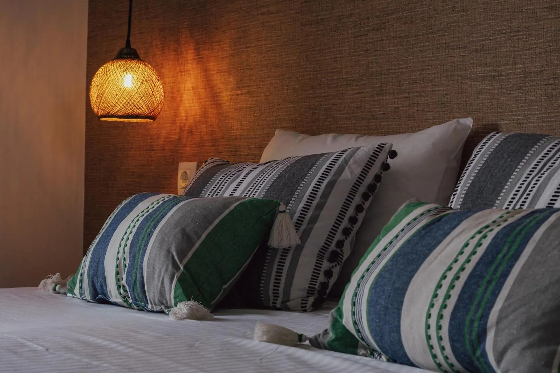 Bed in Anemos Inn by Estia