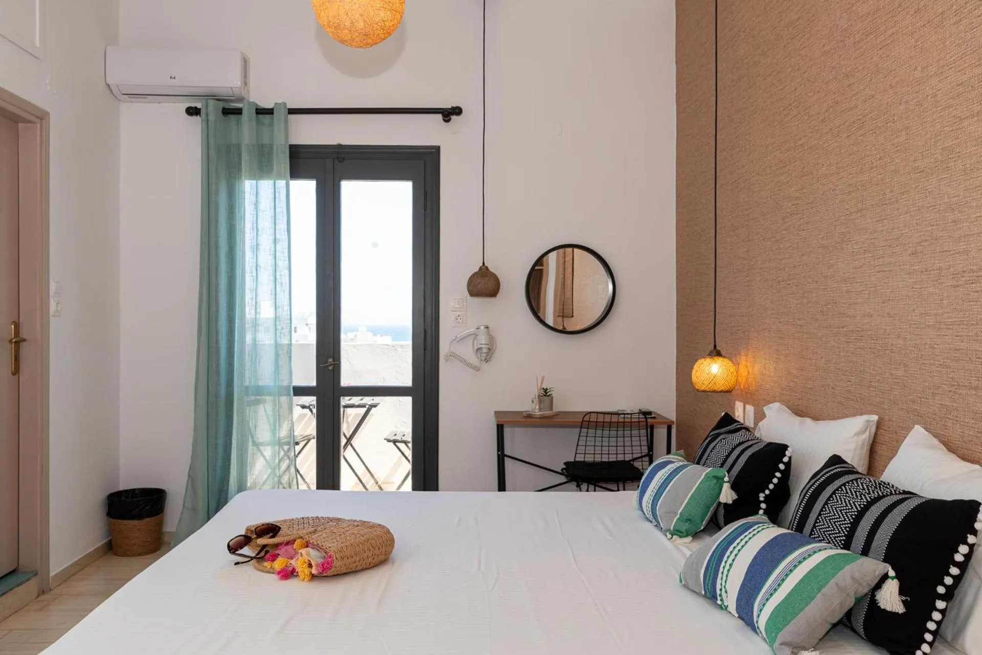 Bed in Anemos Inn by Estia