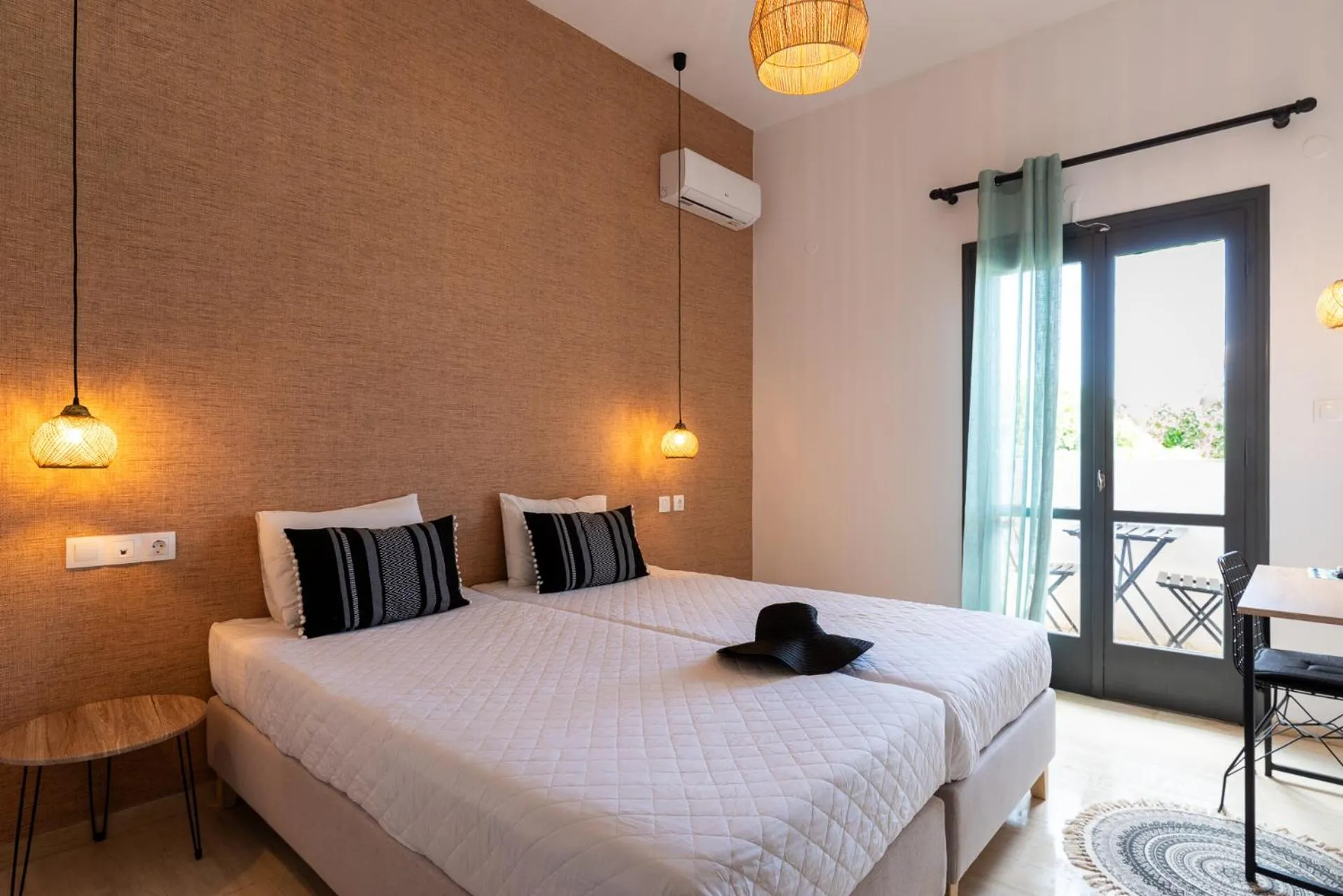 Bed in Anemos Inn by Estia