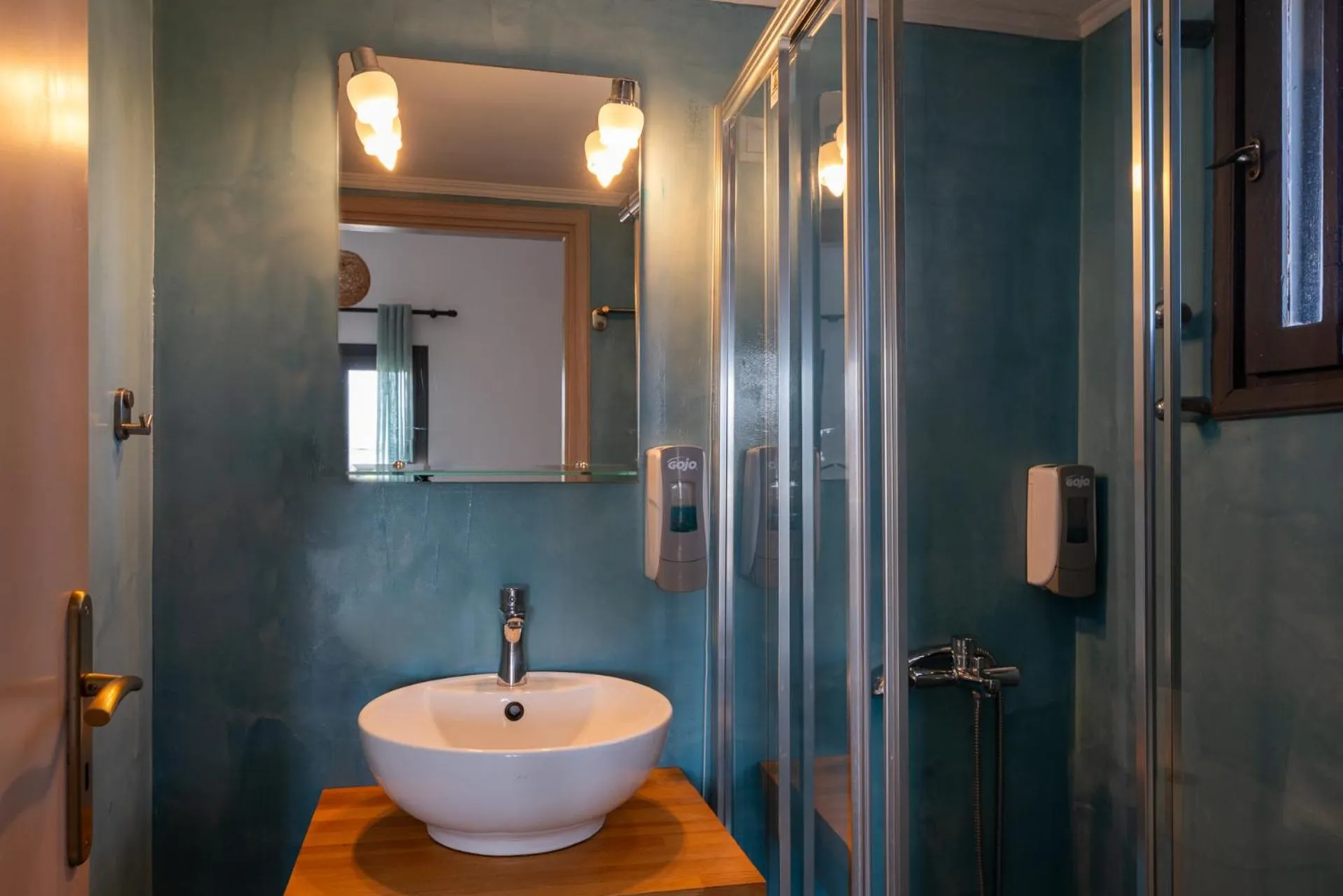 Shower in Anemos Inn by Estia