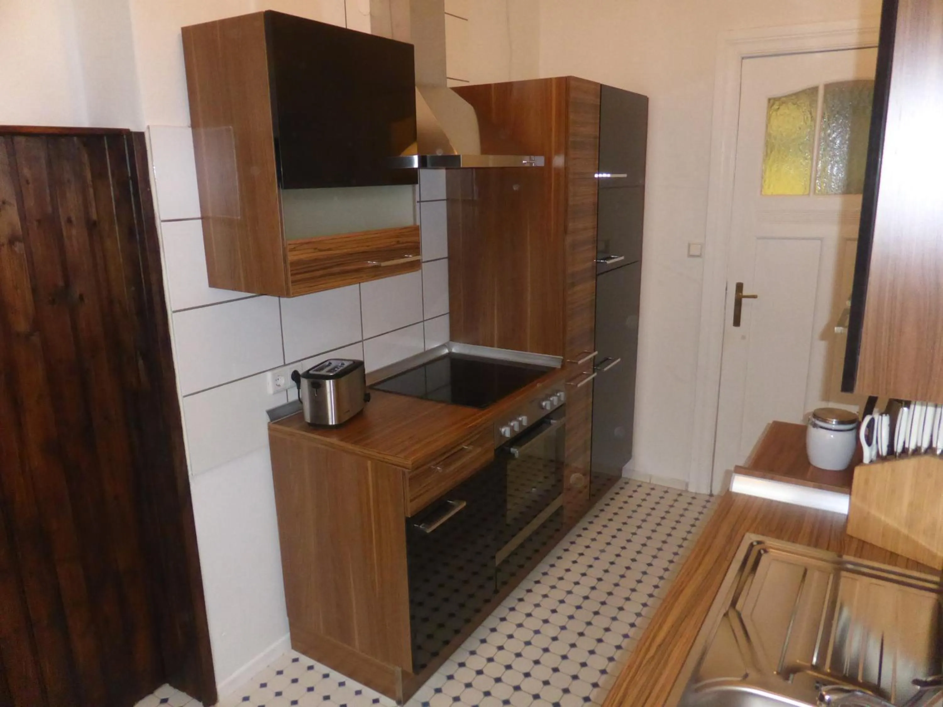 Kitchen or kitchenette in Apartments Dahlie & Nelke