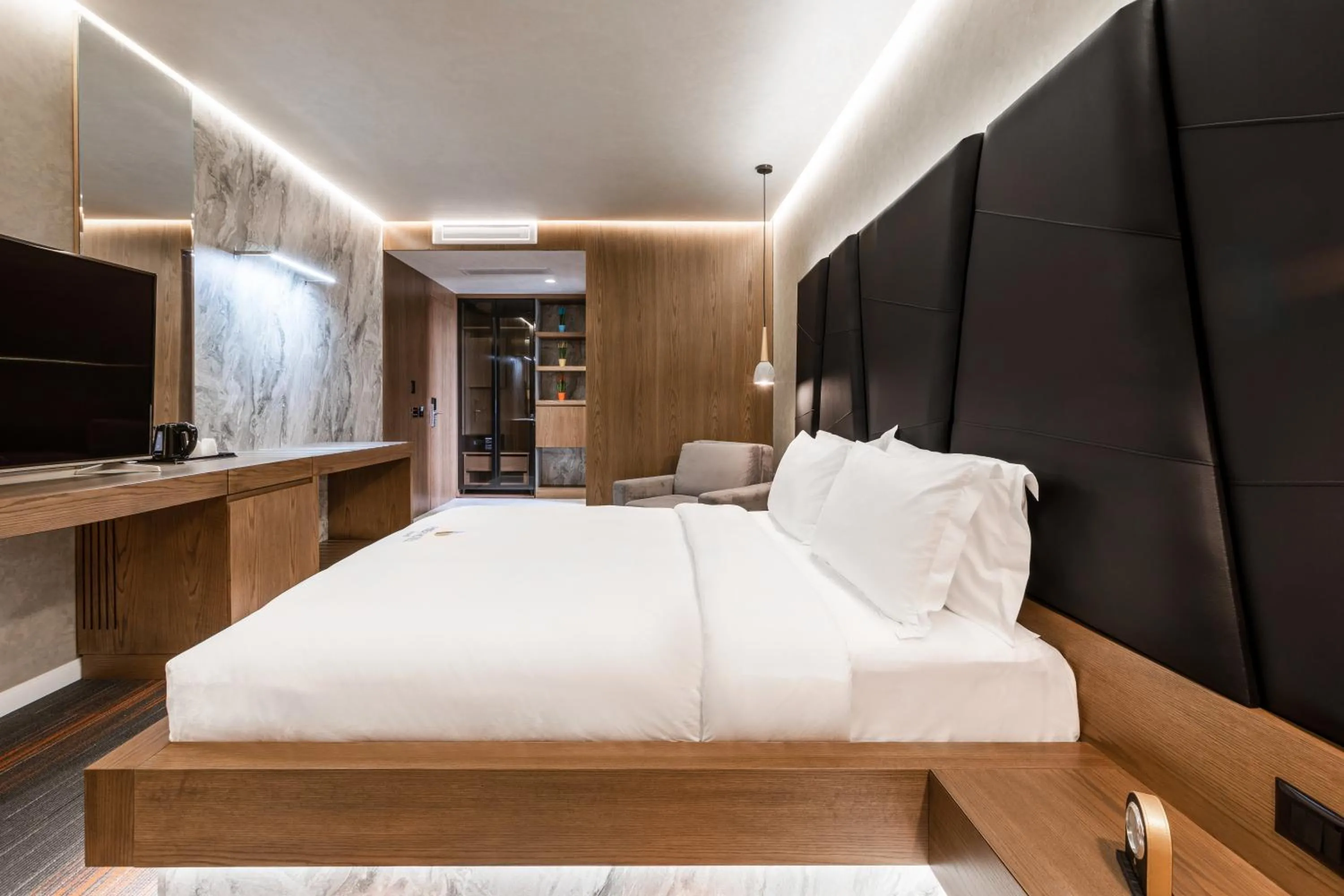 Bed in Pinea Hotel Resort & Spa