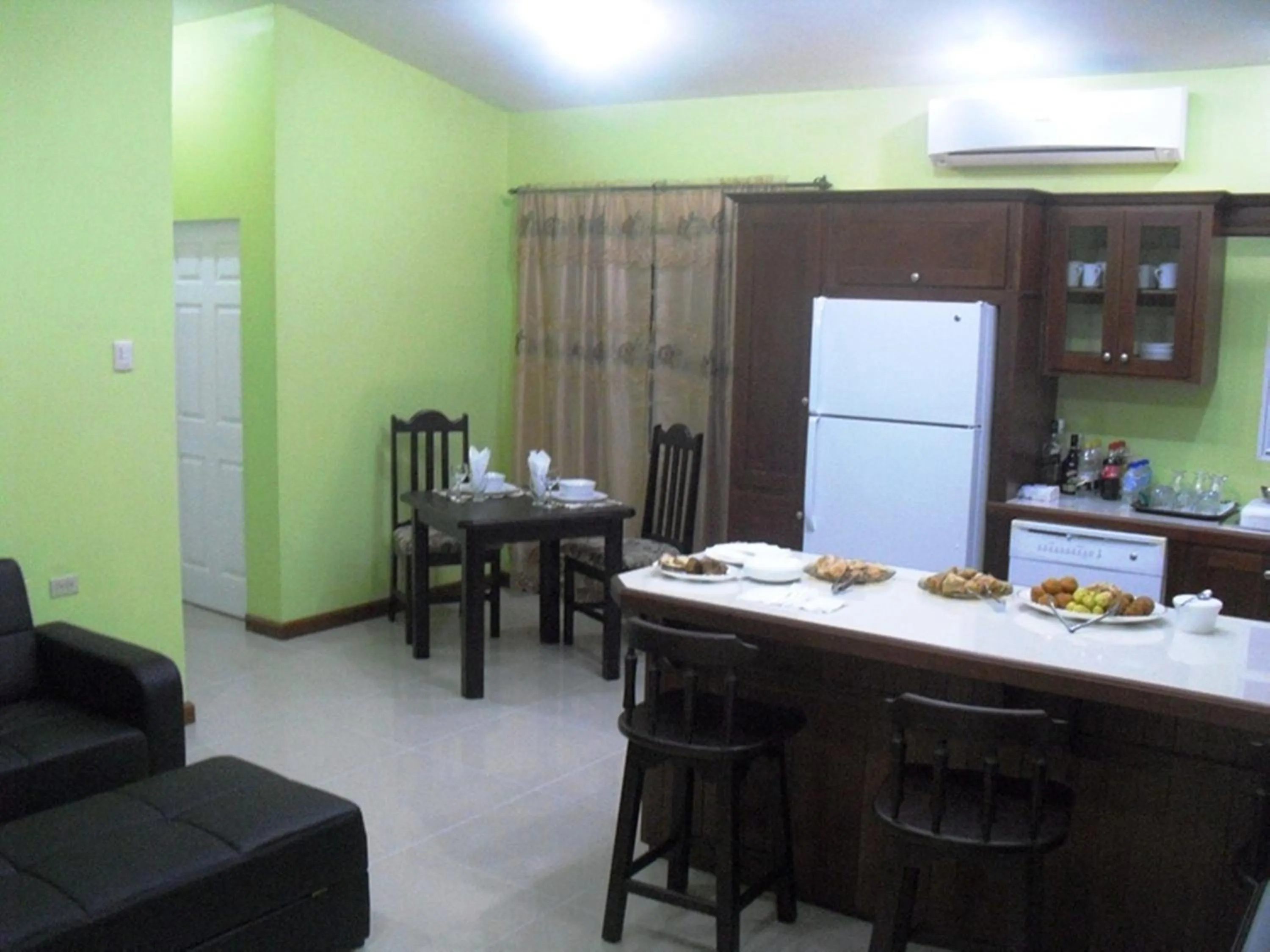 Kitchen or kitchenette in Piarco Village Suites