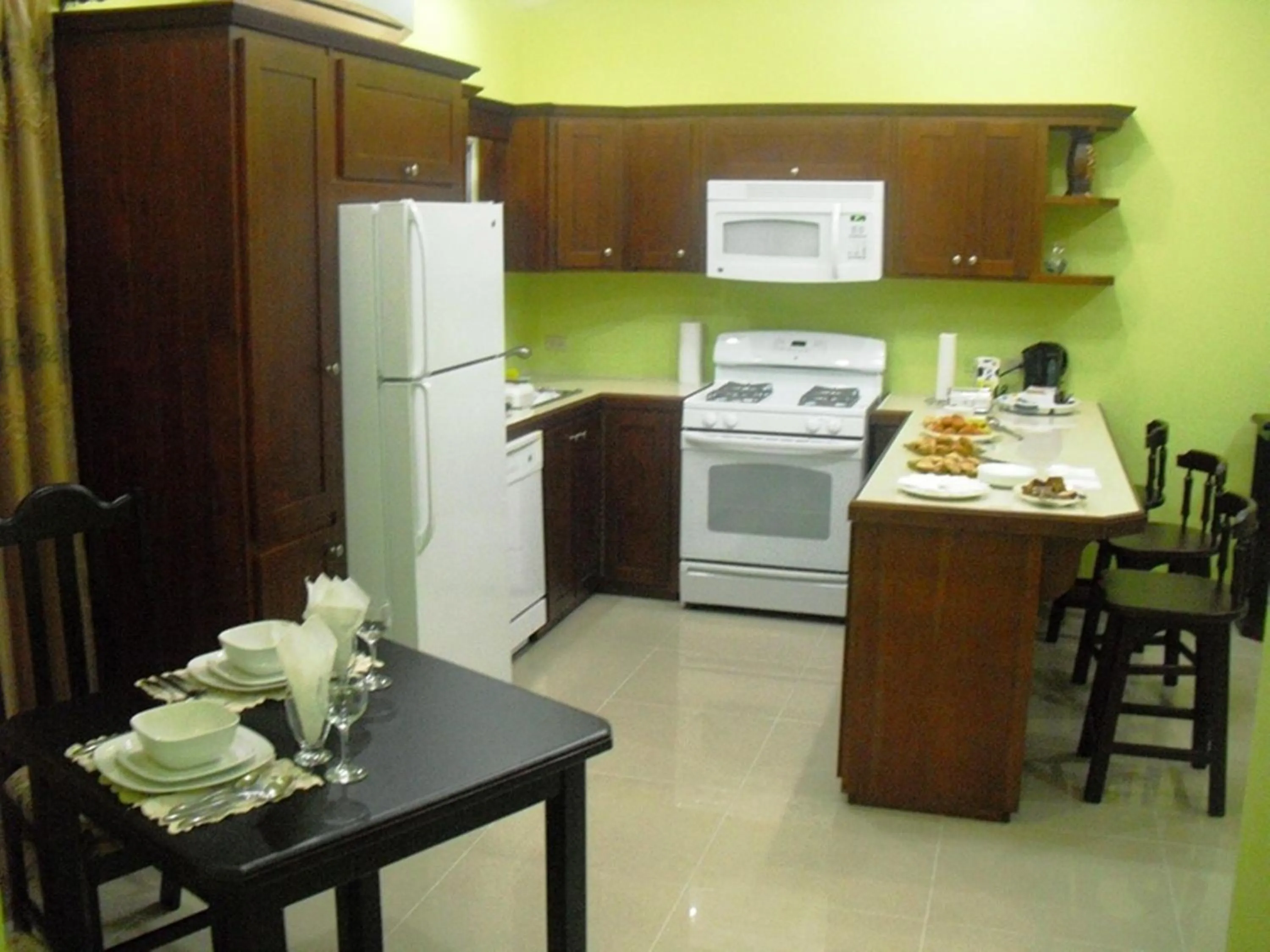 Kitchen or kitchenette in Piarco Village Suites