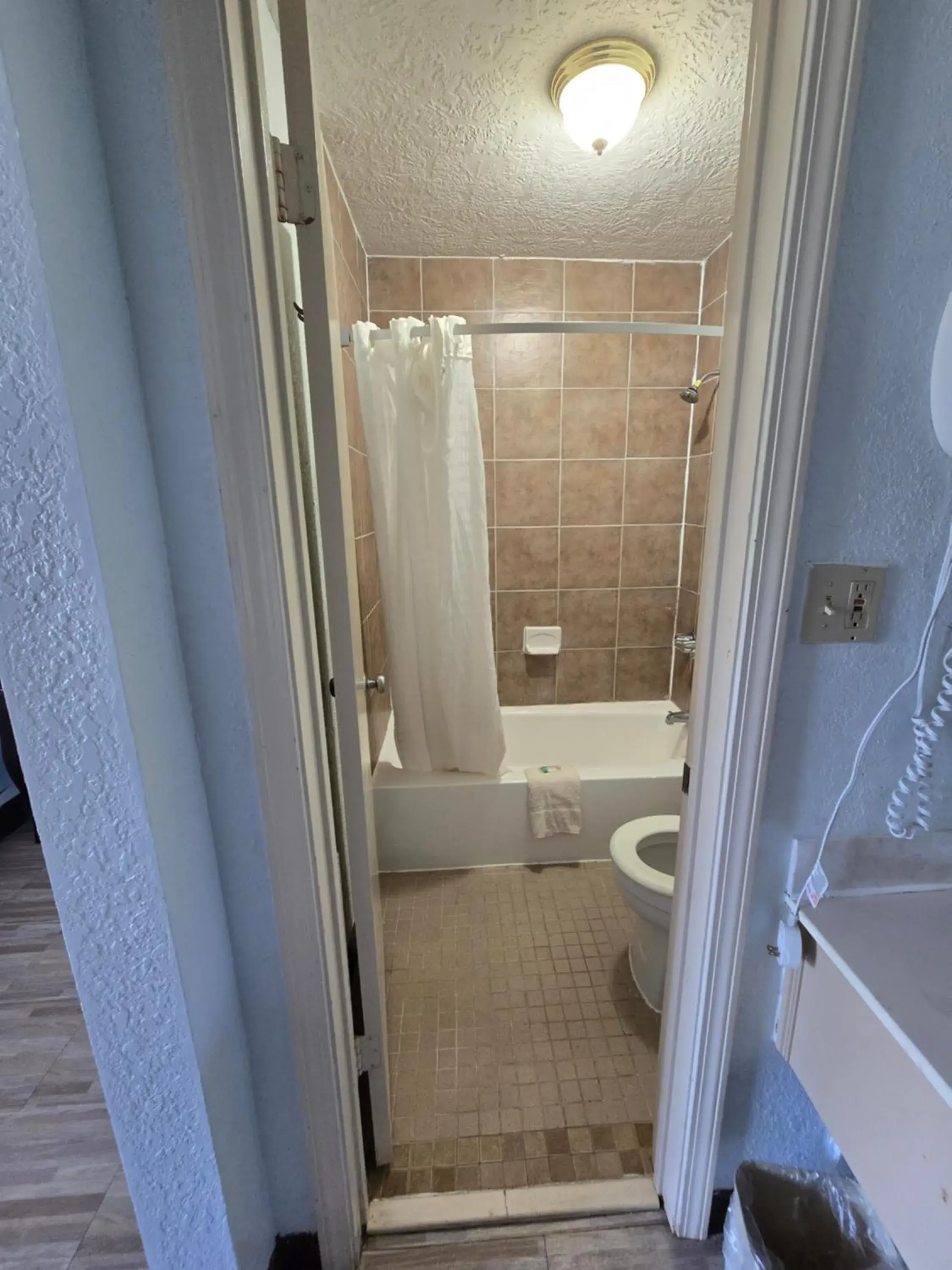 Bathroom in Best Price Motel & Suites Bathroom in Best Price Motel & Suites