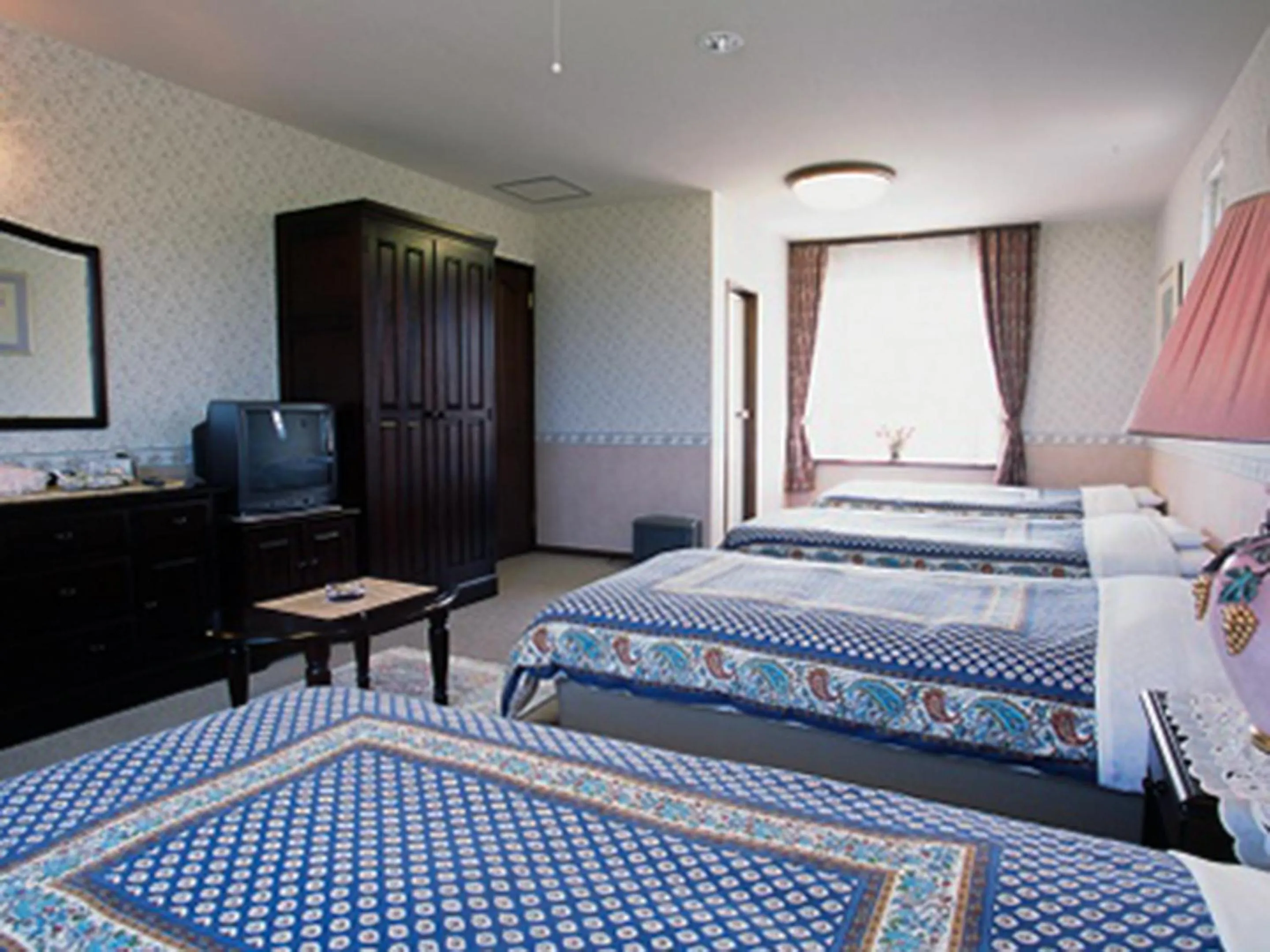 Bed in Petit Hotel Corinthian