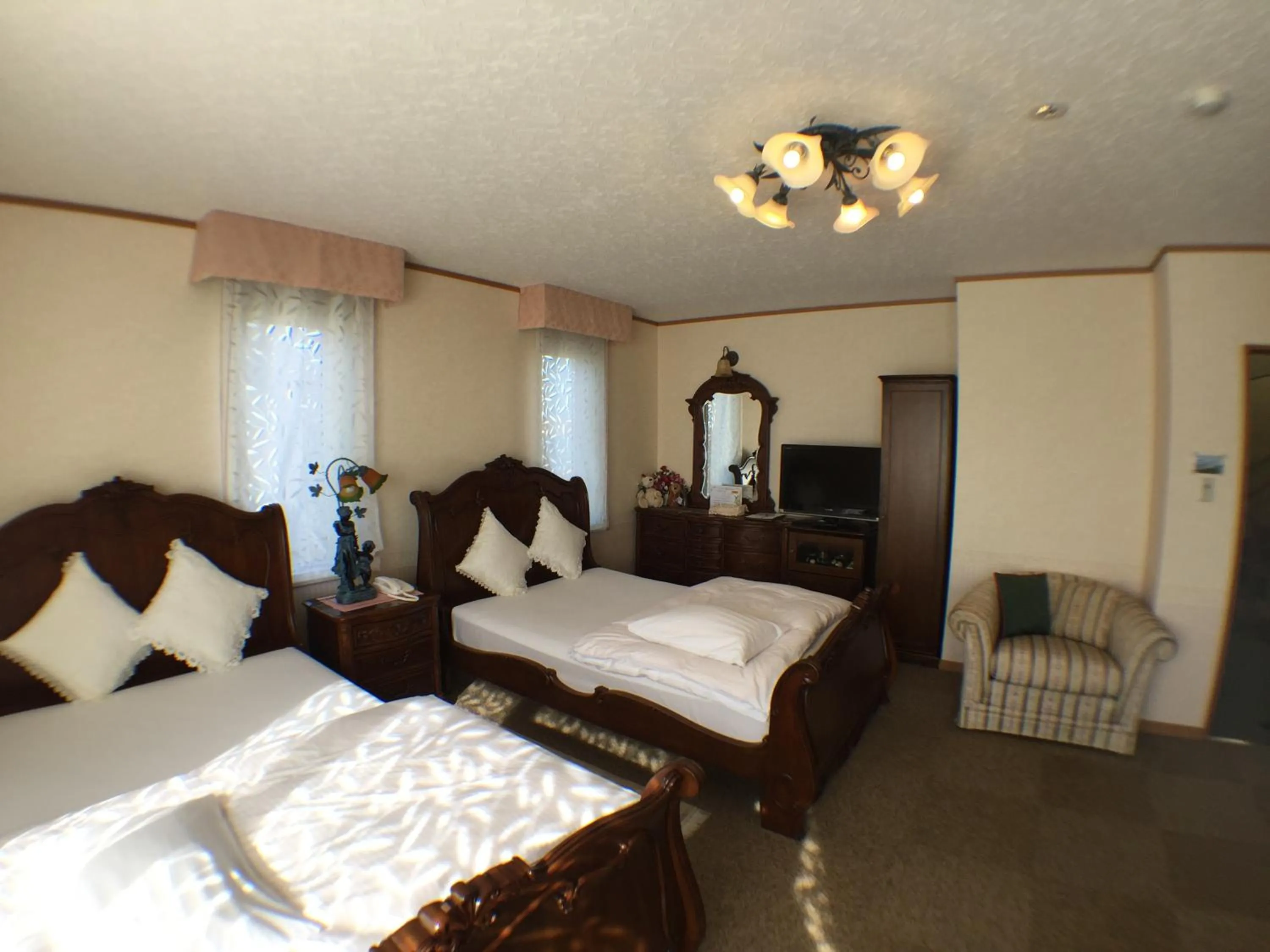 Bedroom in Petit Hotel Corinthian