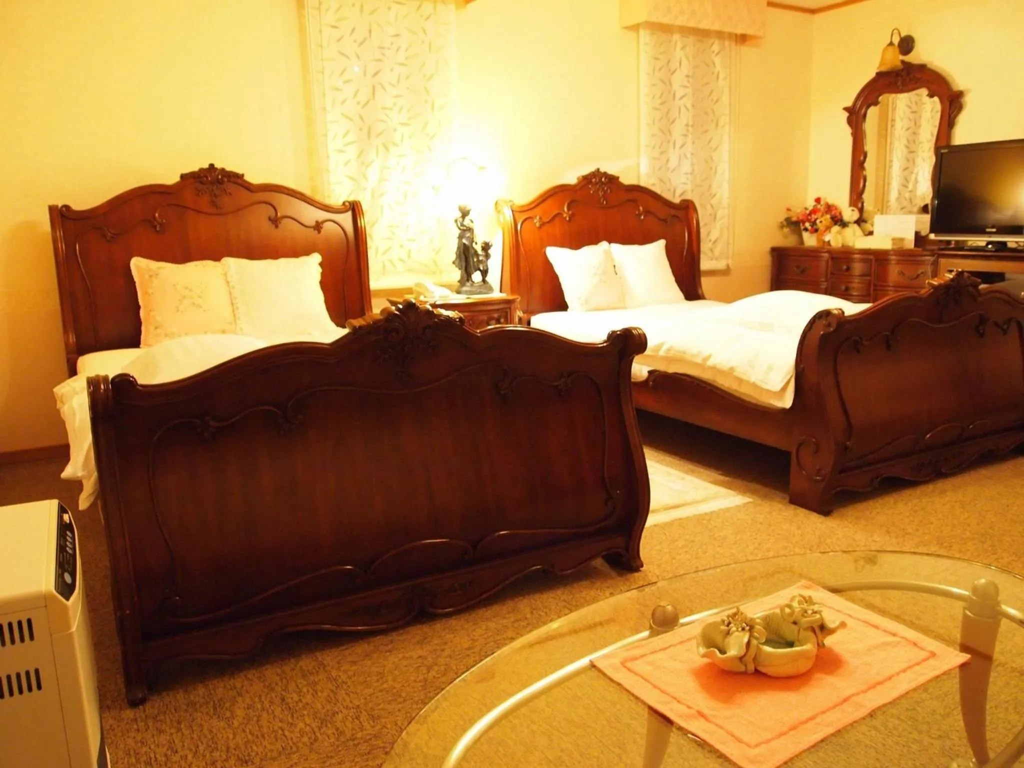 Bed in Petit Hotel Corinthian