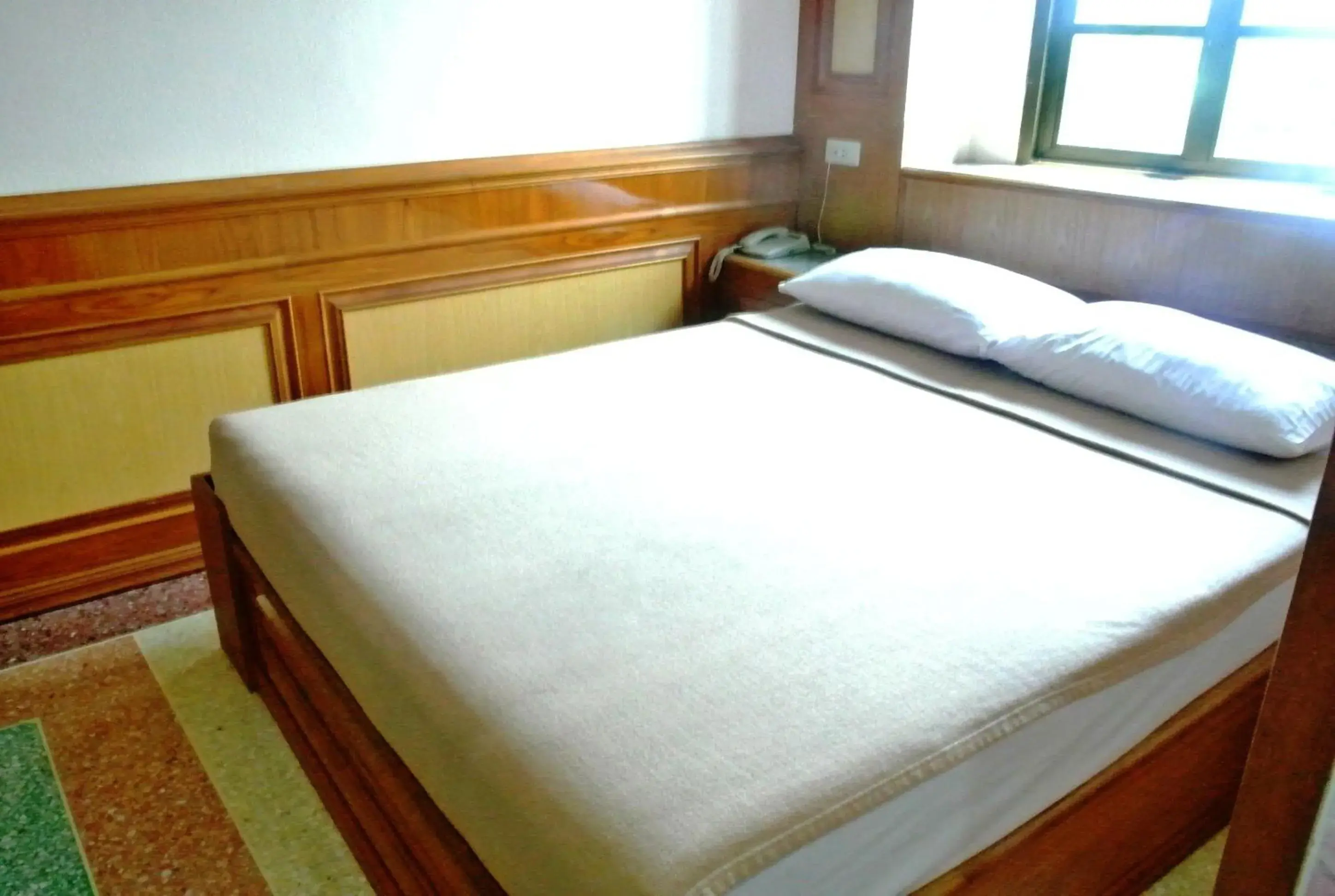 Bed in Rose Garden Hotel Bed in Rose Garden Hotel