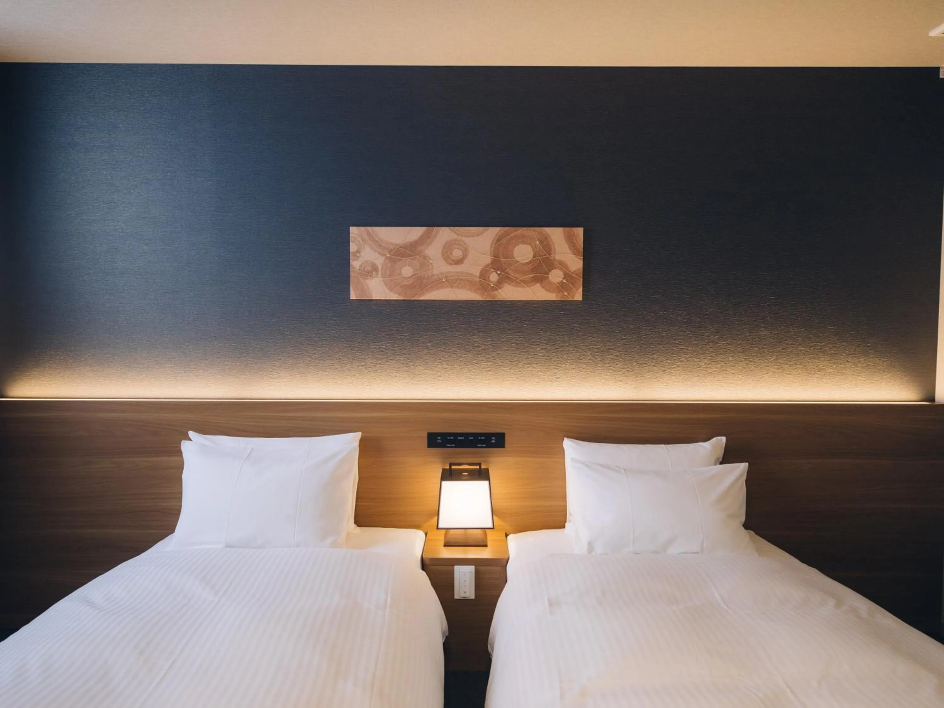 Bed in MIMARU SUITES Kyoto Shijo