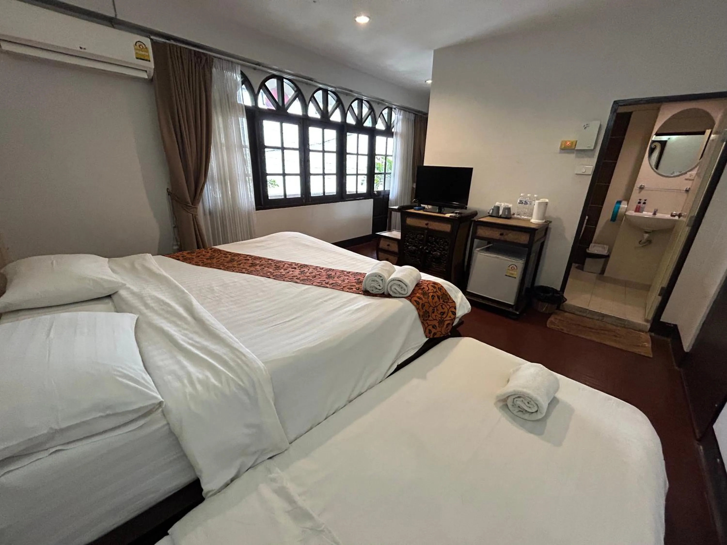 Bed in Kamala's Boutique Guesthouse