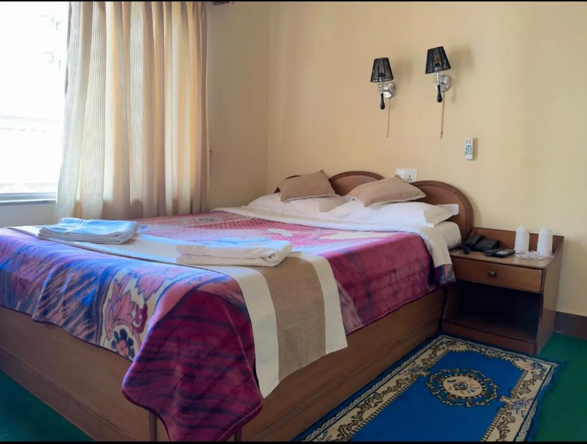 Bed in Green Tara Hotel