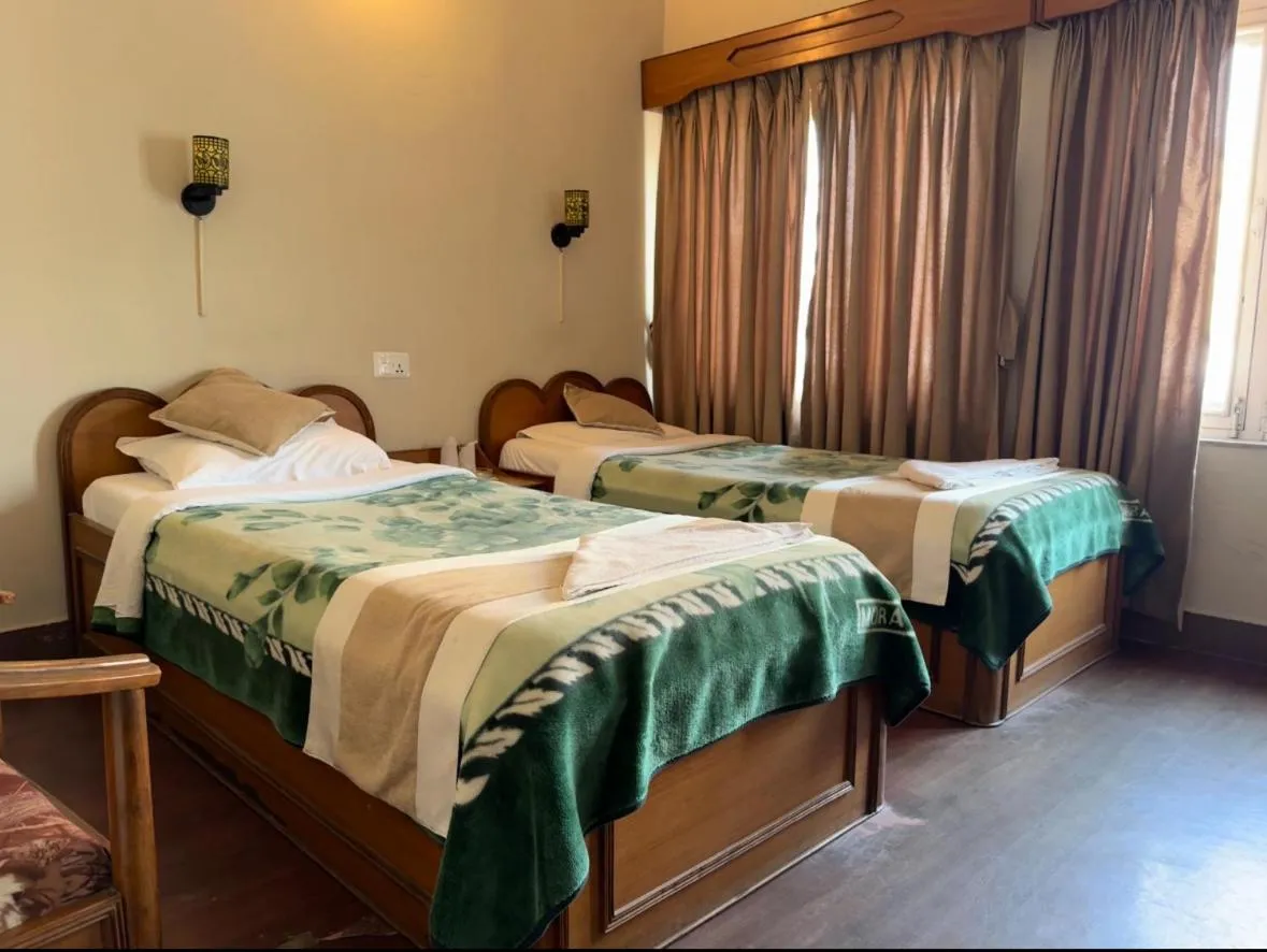 Bed in Green Tara Hotel