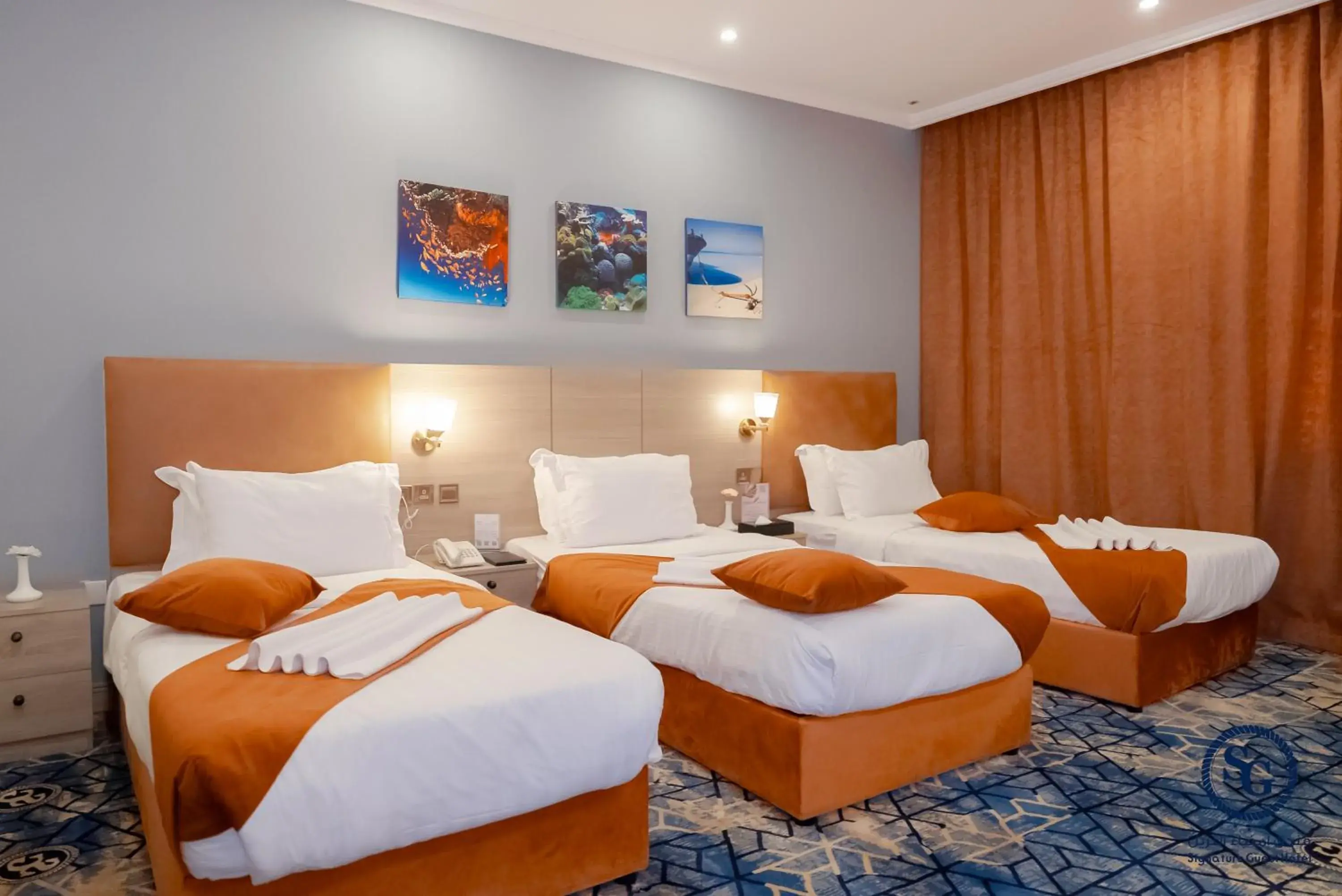 Triple Room in Signature Guest Hotel فندق إمضاء النزيل الفندقية Triple Room in Signature Guest Hotel فندق إمضاء النزيل الفندقية