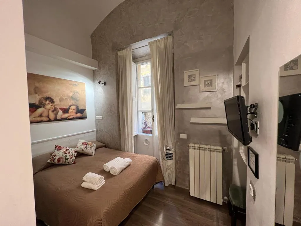 Bed in Marcelina vaticans rooms