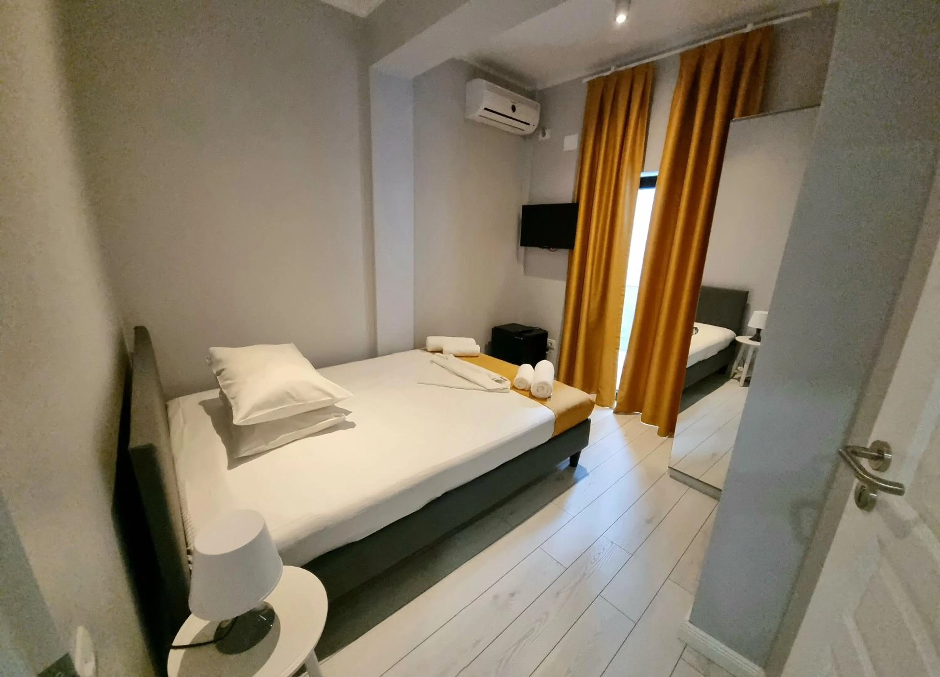 Photo of the whole room, Bed in CHG Boutique