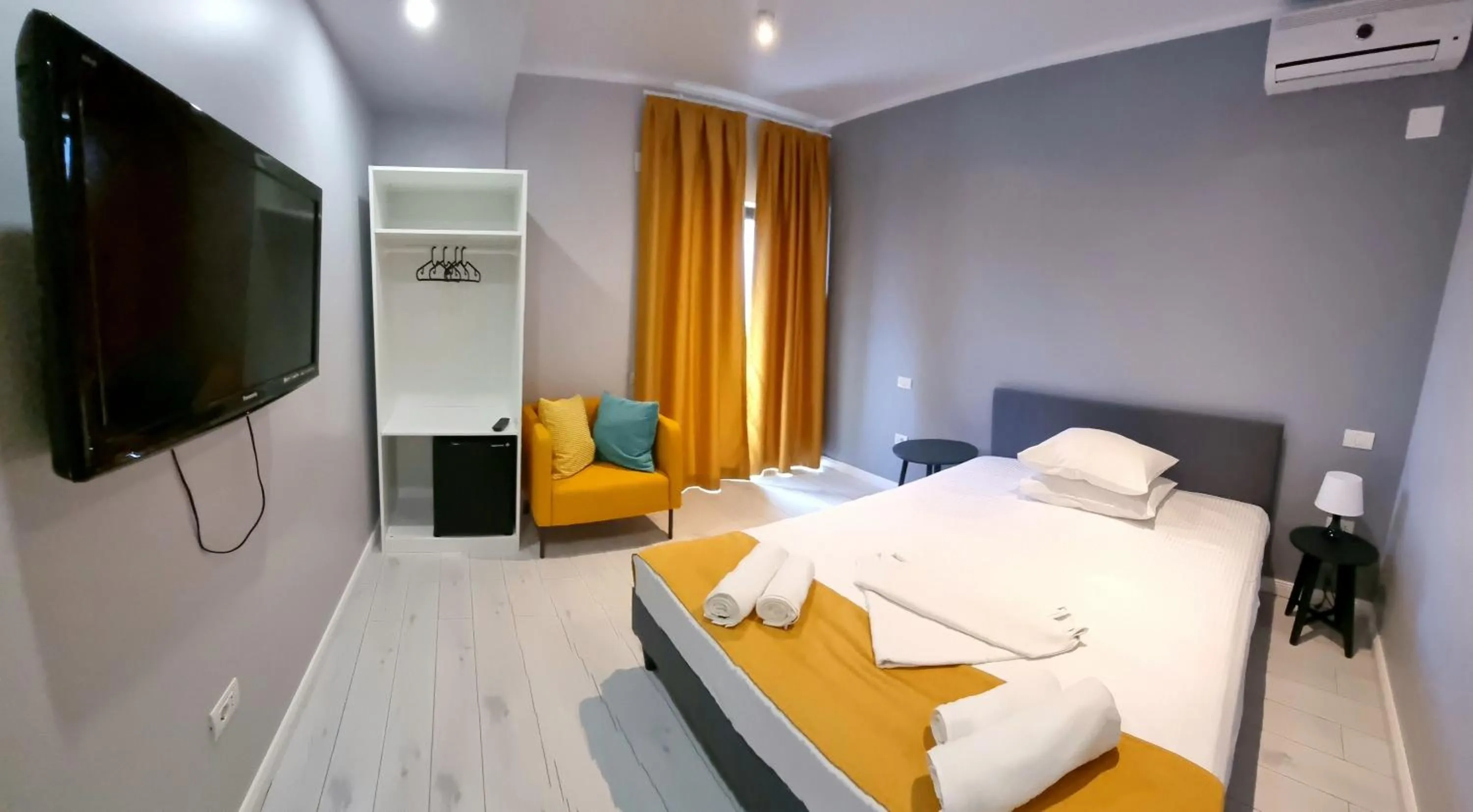 Photo of the whole room, Bed in CHG Boutique