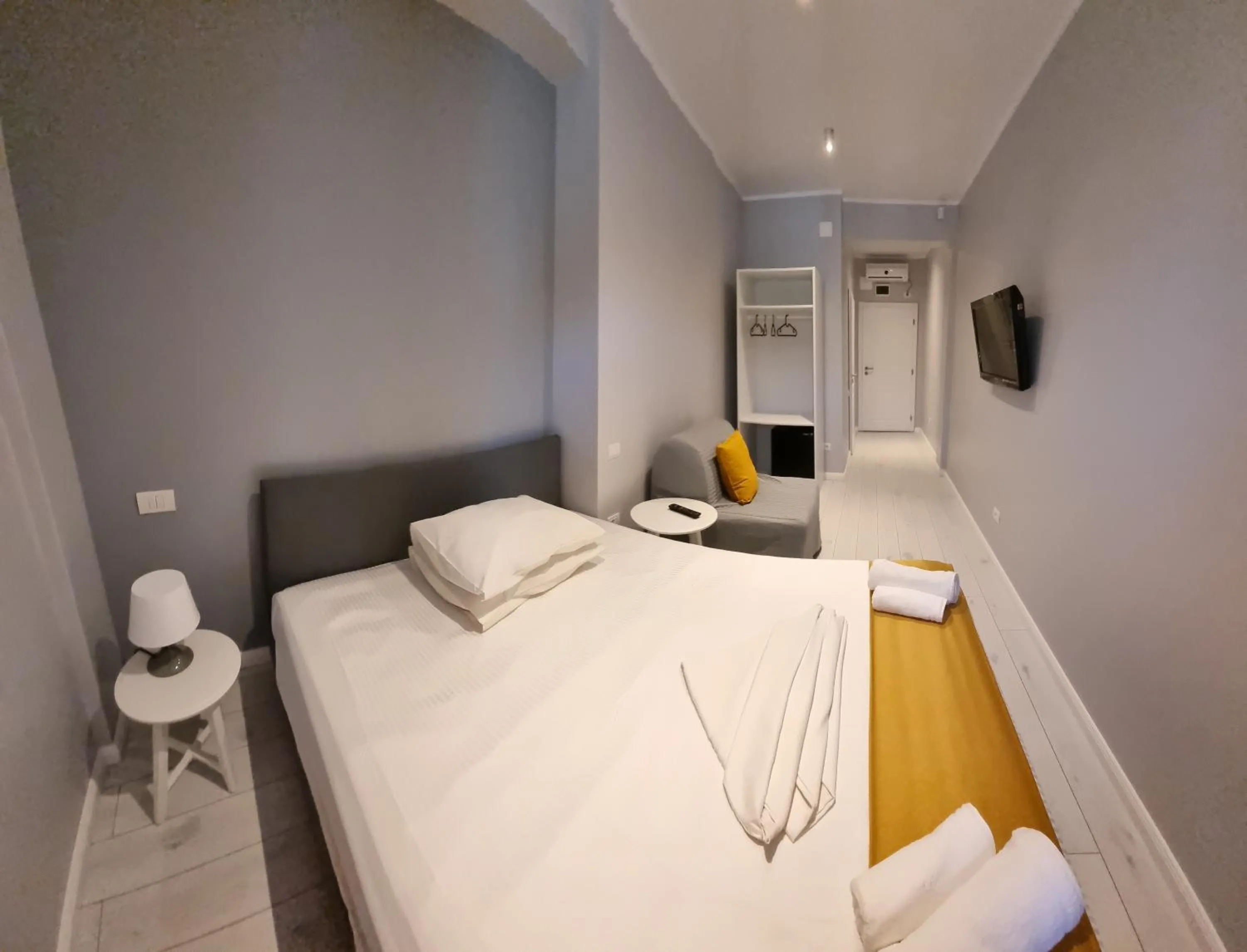 Photo of the whole room, Bed in CHG Boutique