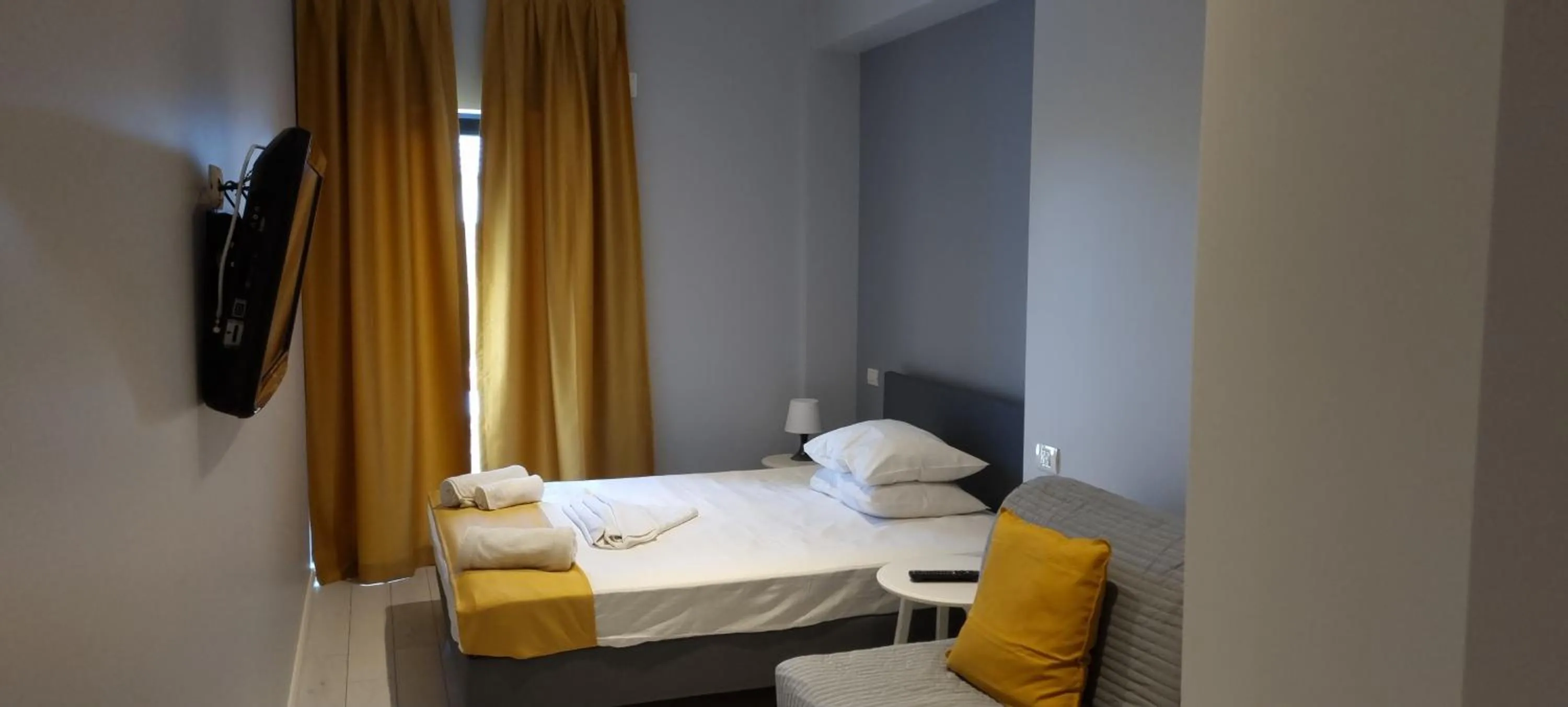 Photo of the whole room, Bed in CHG Boutique