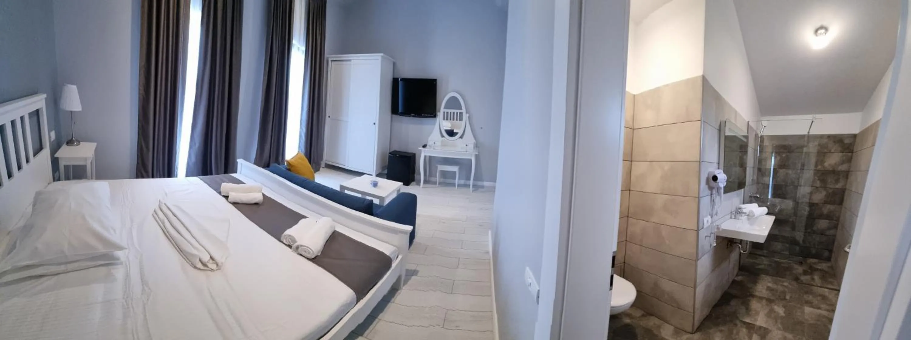 Photo of the whole room, Bed in CHG Boutique