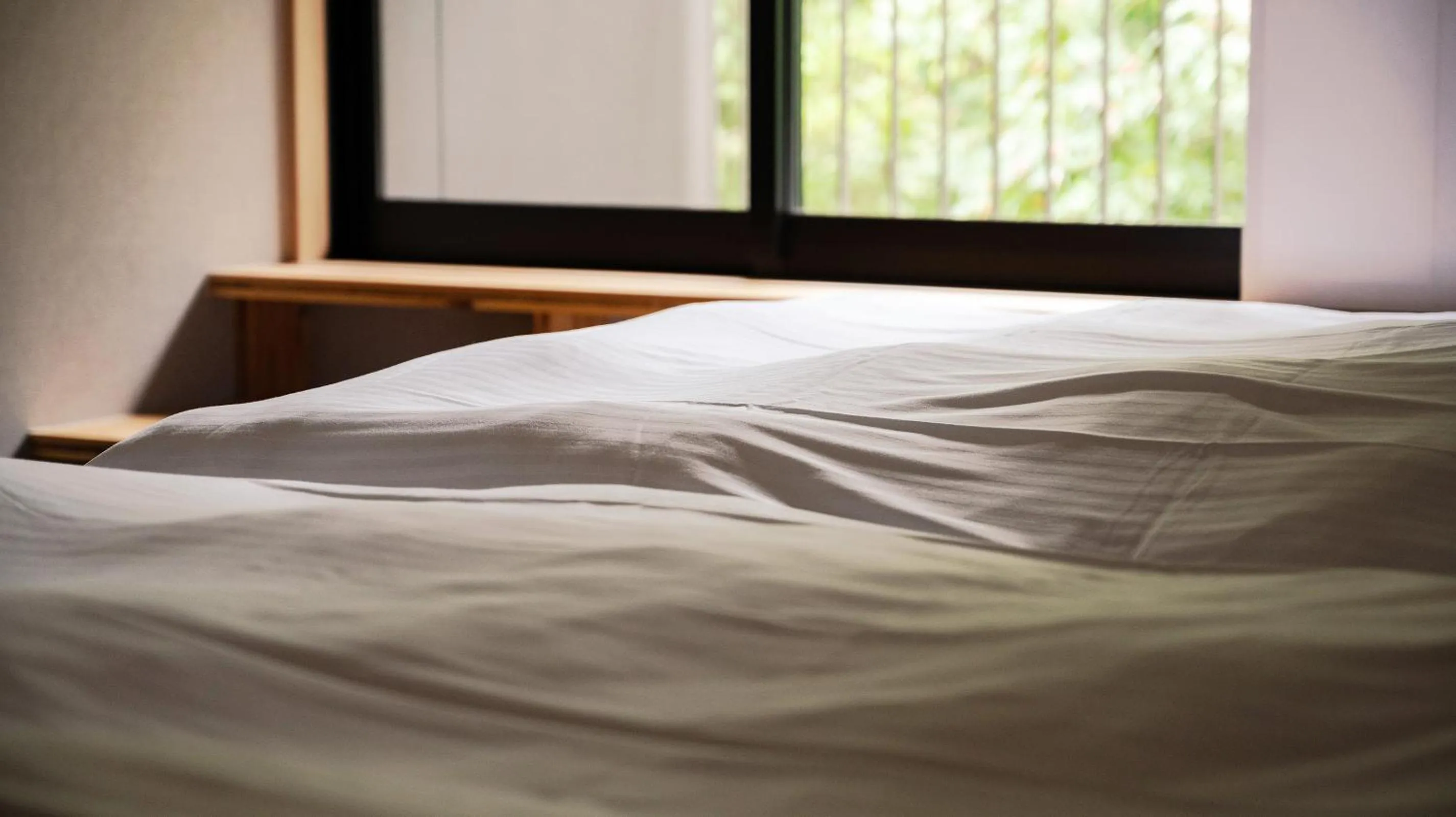 View (from property/room), Bed in Beppu Hotel Negura