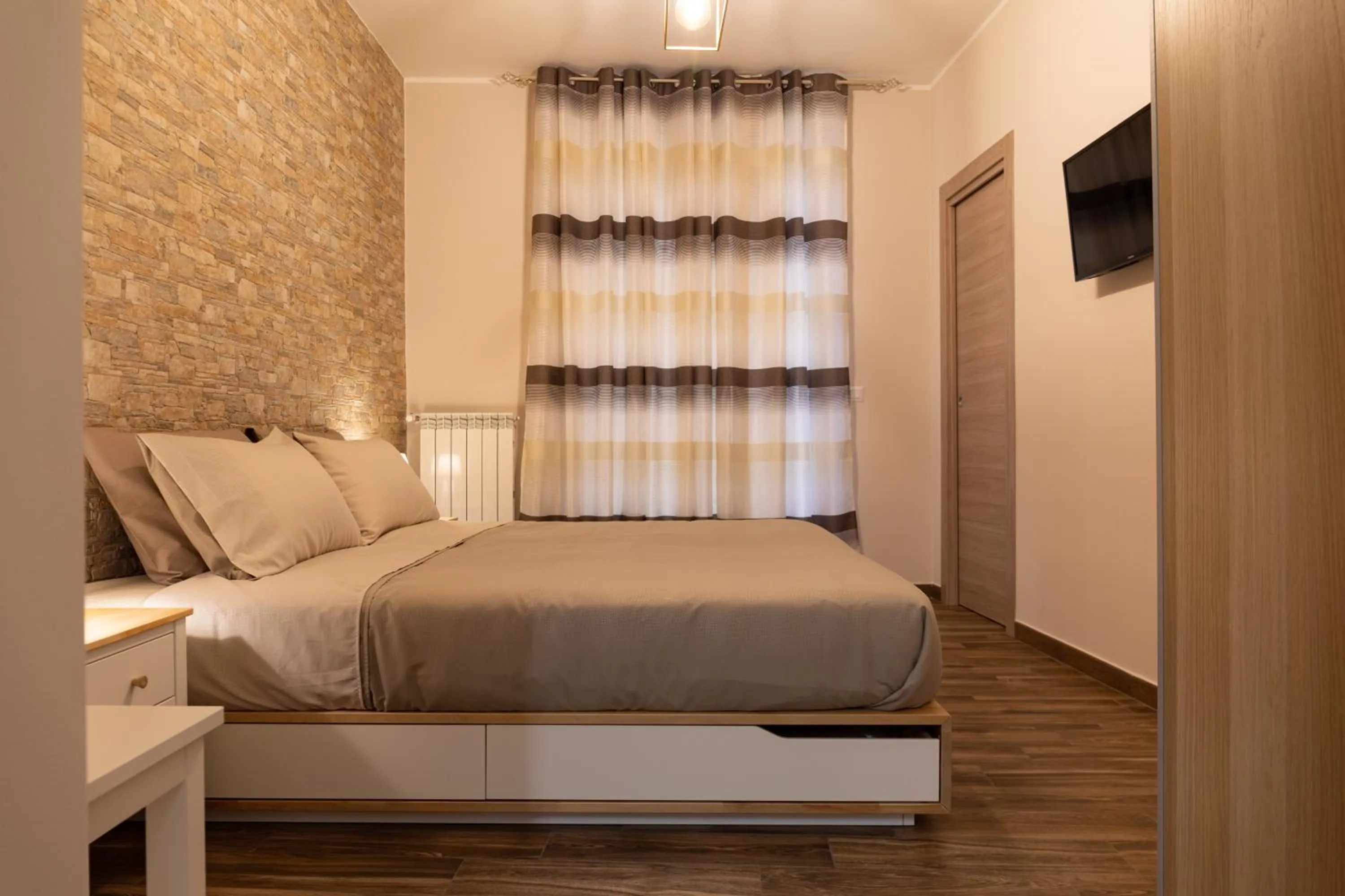 Bed in Tizzy Apartment & Rooms