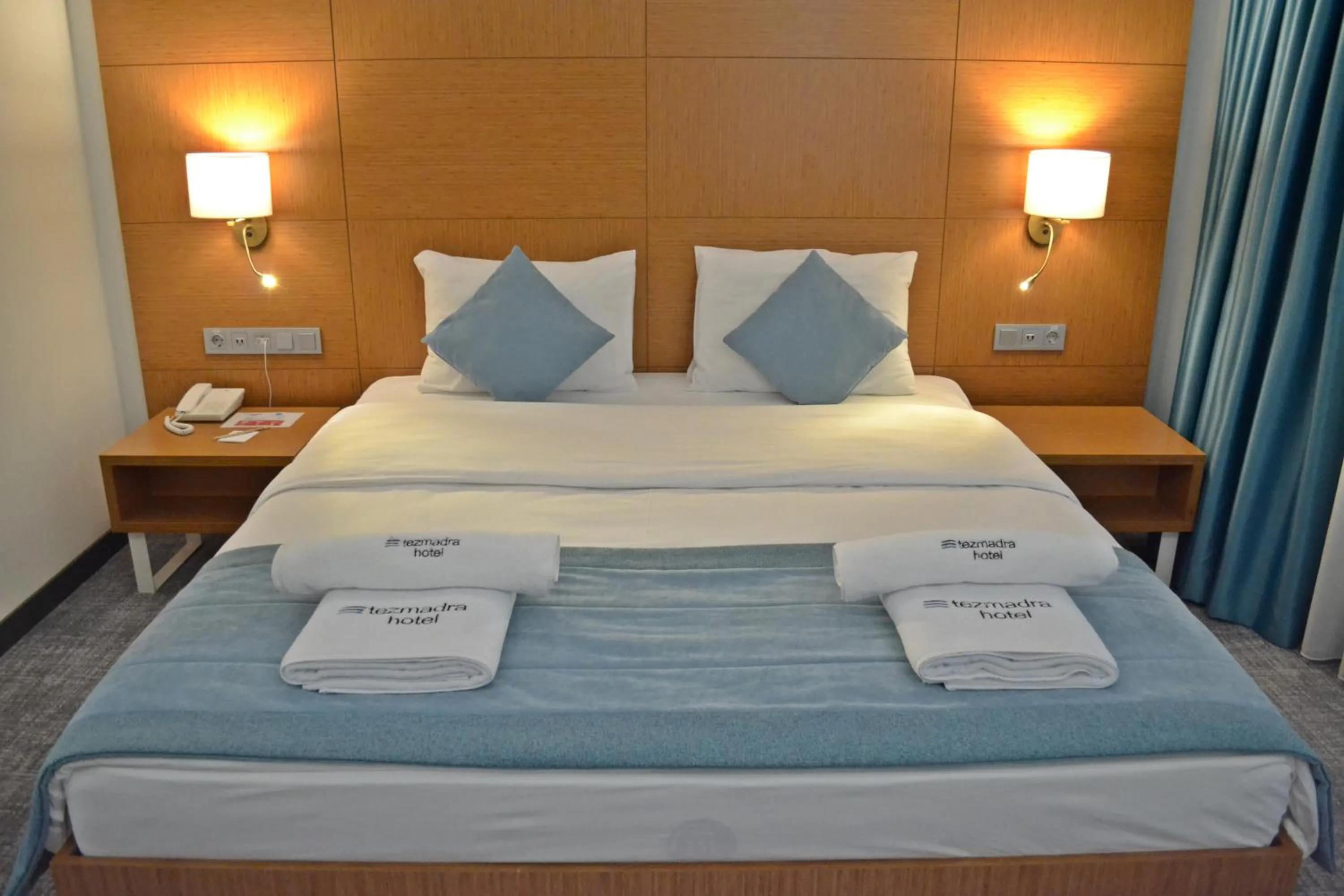 Bed in TEZMADRA HOTEL