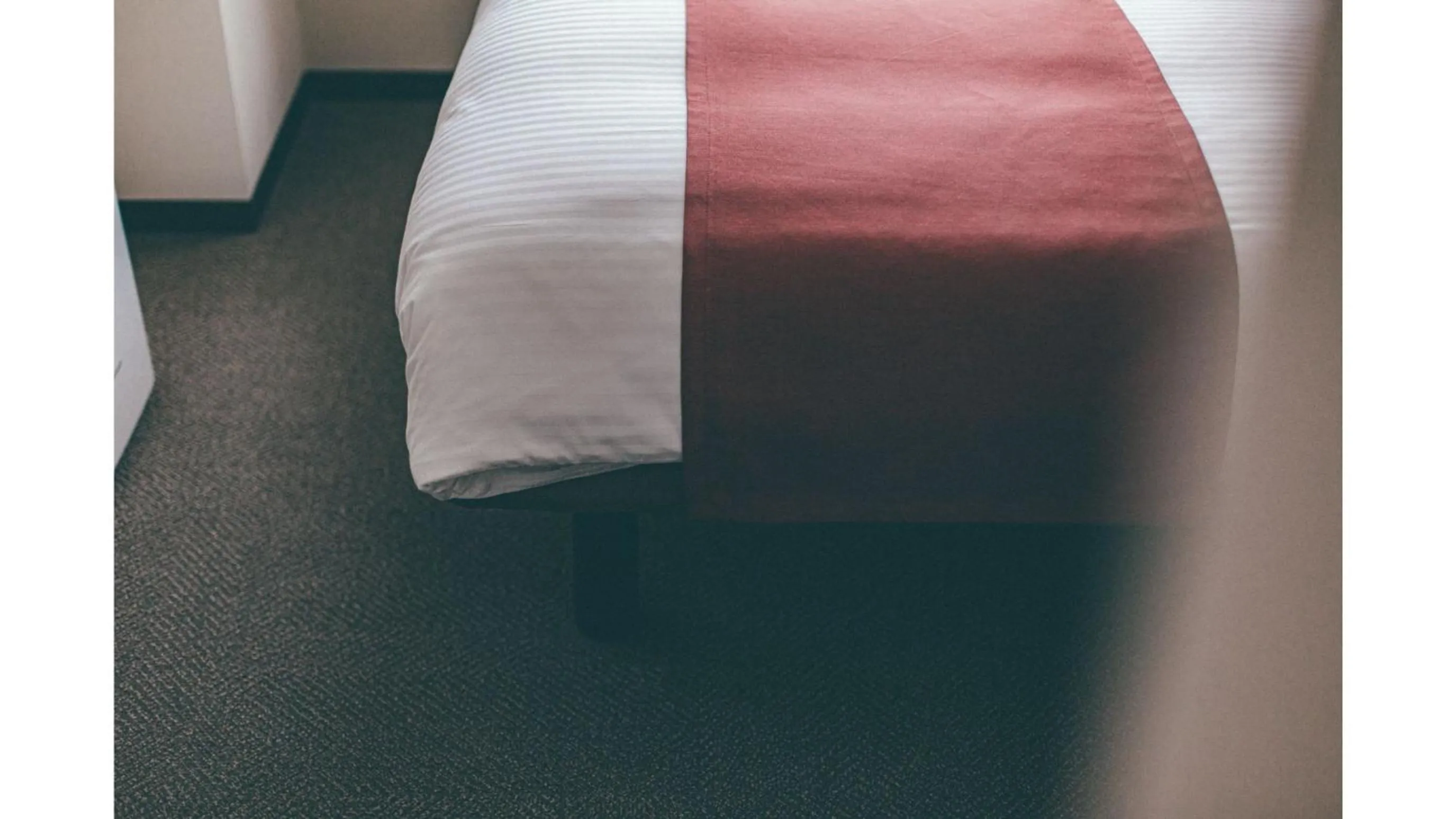 Bed in Kuretake Inn Premium Shizuoka Annex