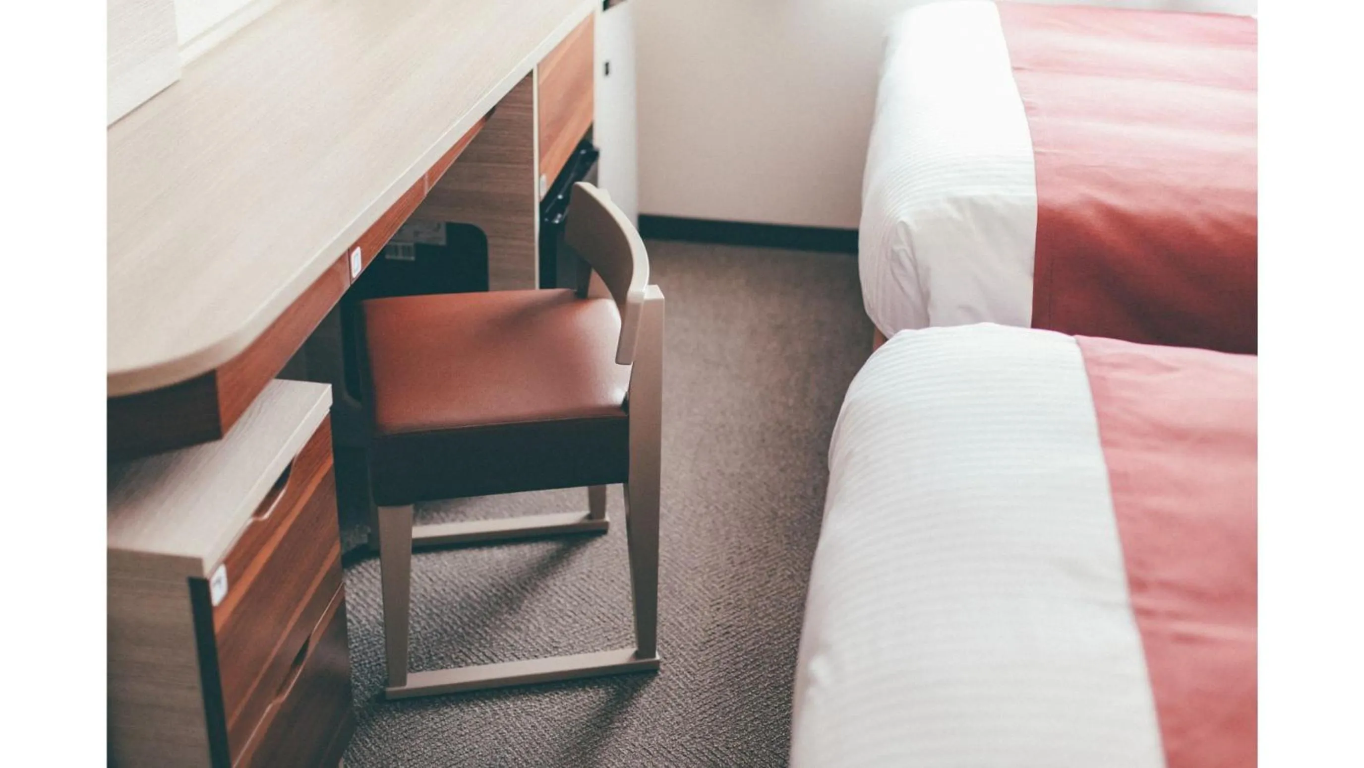 Bed in Kuretake Inn Premium Shizuoka Annex