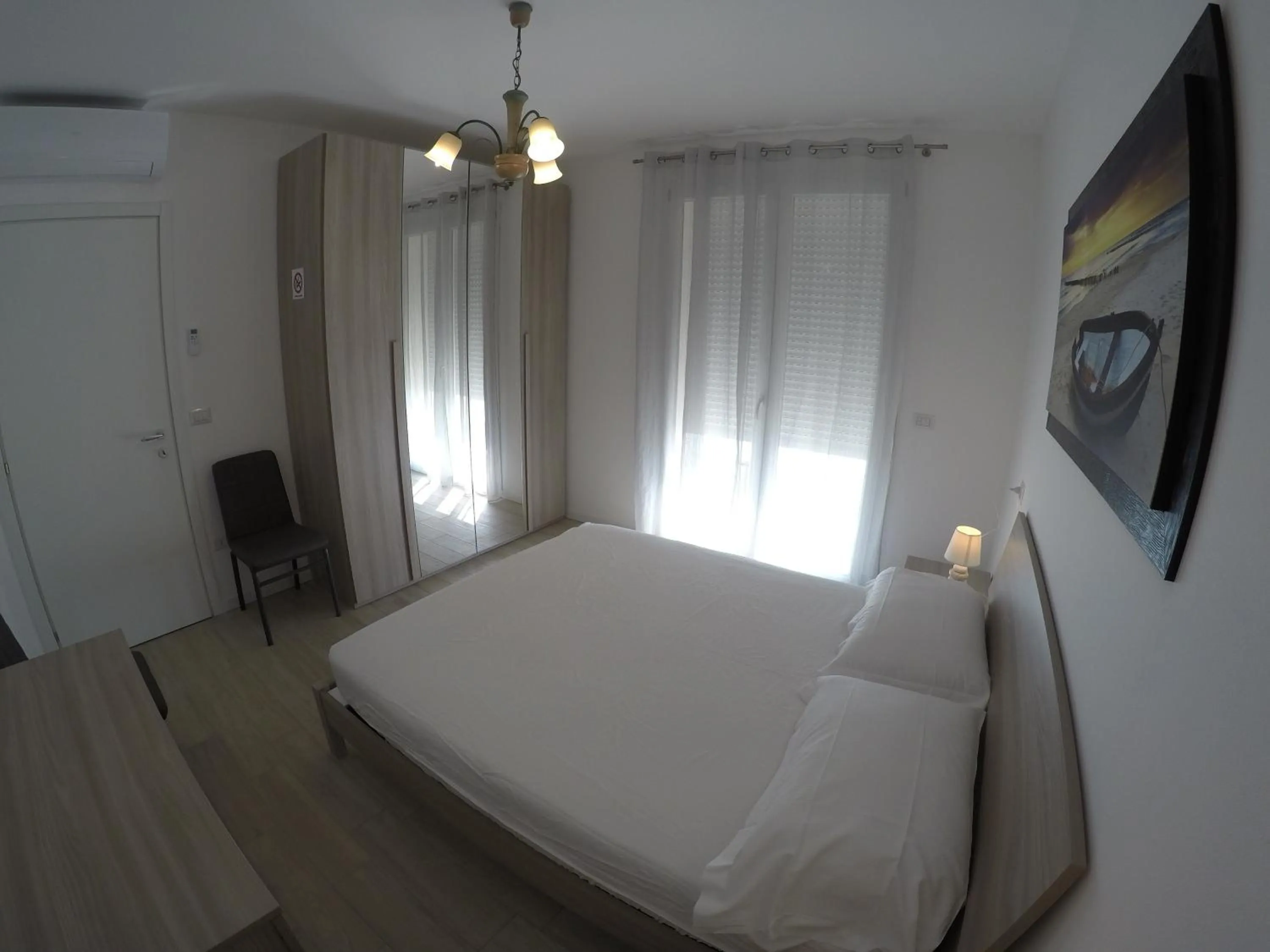 Bedroom in RESIDENCE CAORLE TRILOCALE CON PISCINA - Agenzia Cocal