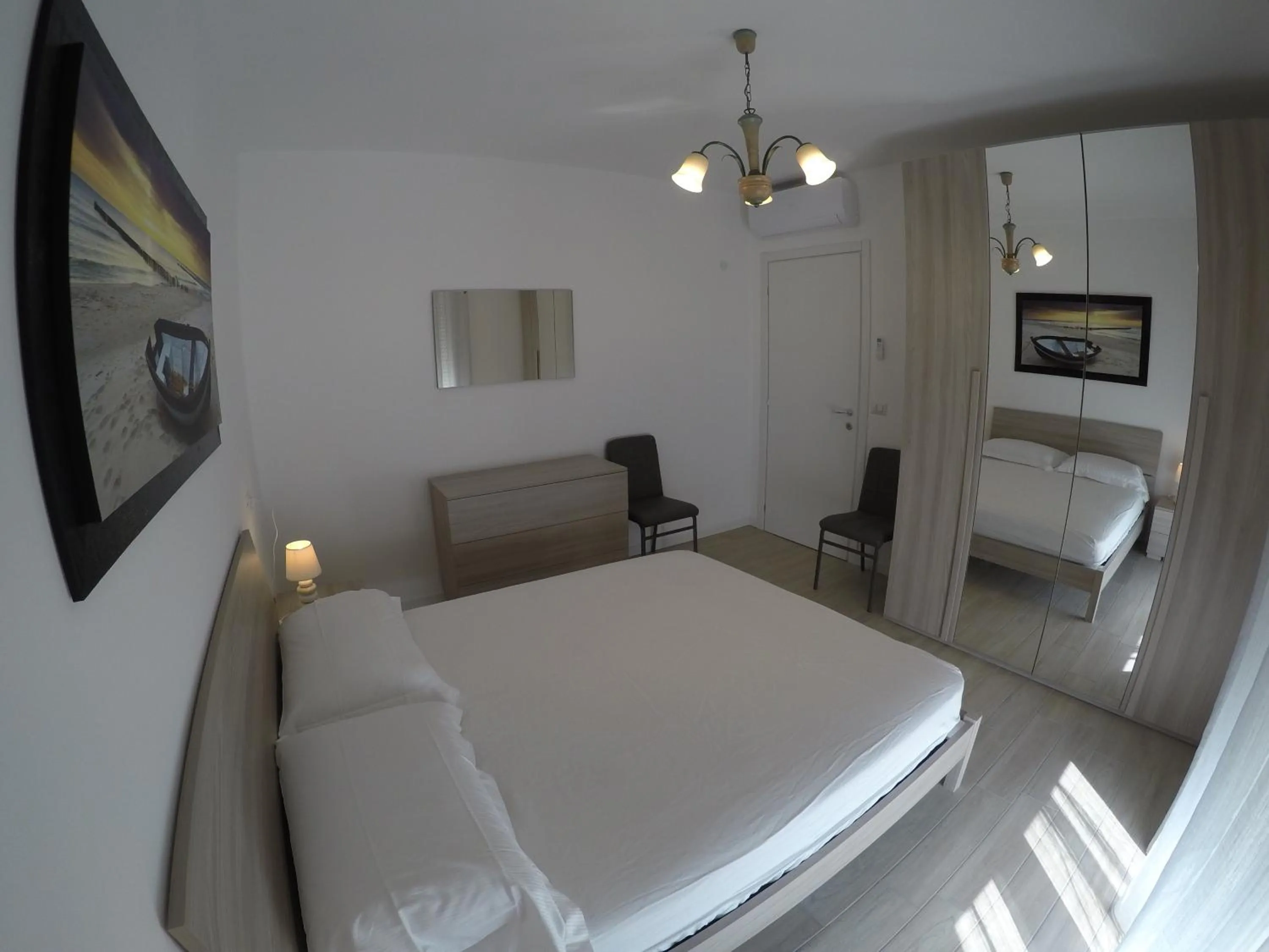 Bedroom in RESIDENCE CAORLE TRILOCALE CON PISCINA - Agenzia Cocal