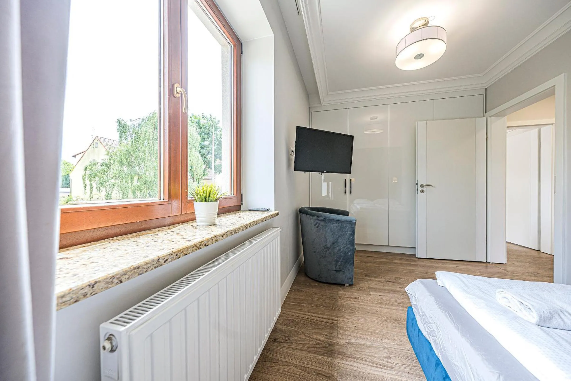 Communal lounge/ TV room, Bed in Apartamenty Martini