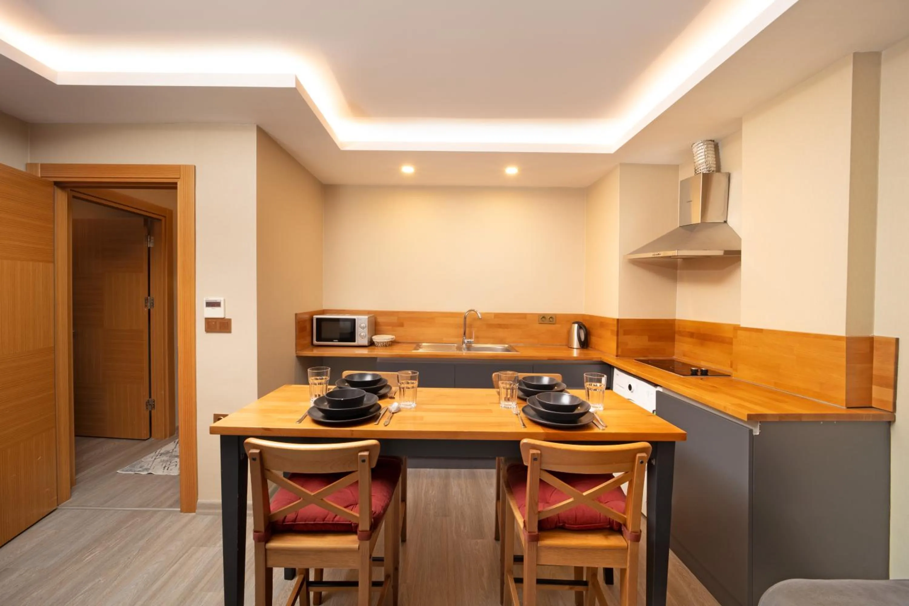 Kitchen or kitchenette in Family Time Suites Hotel