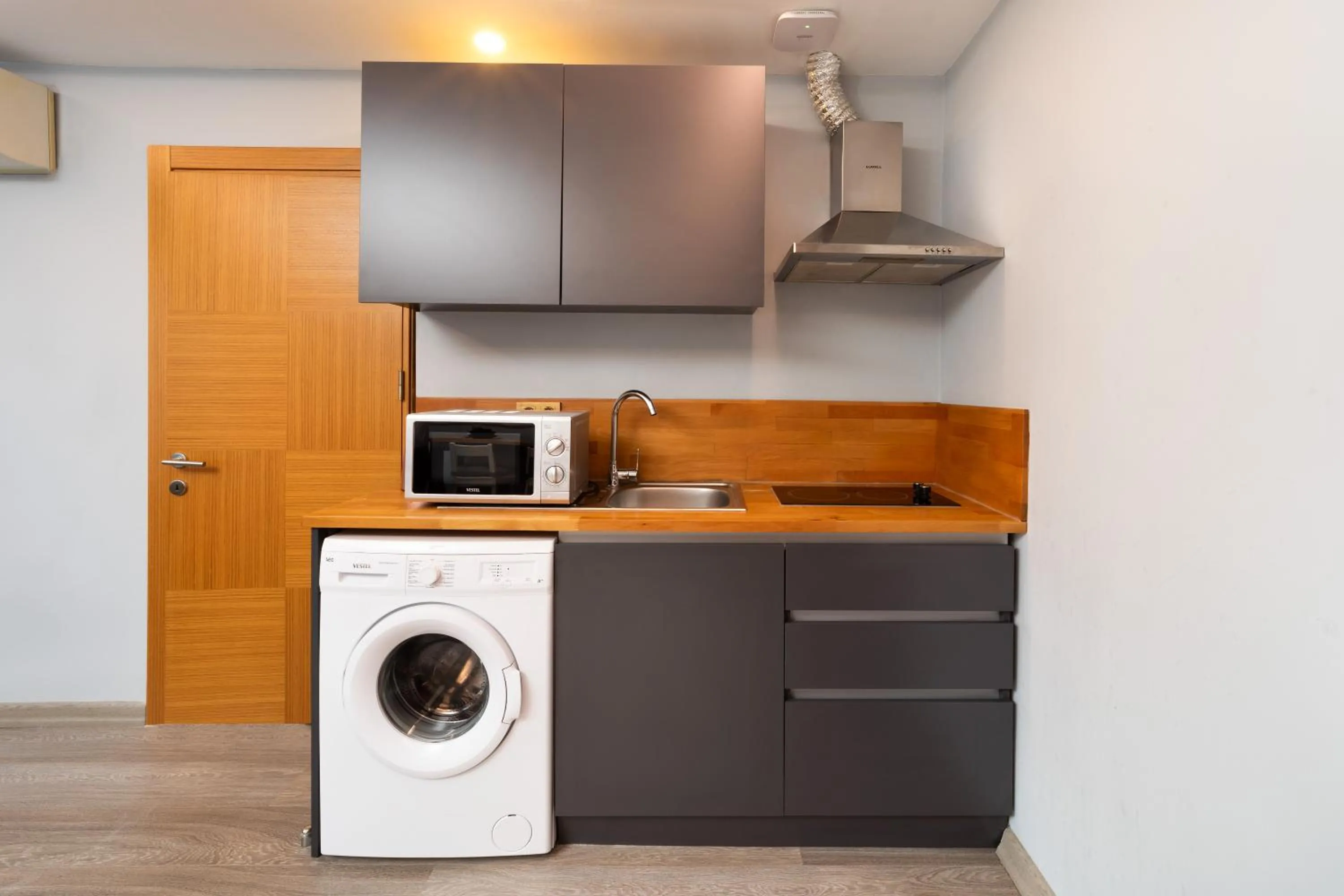 Kitchen or kitchenette in Family Time Suites Hotel