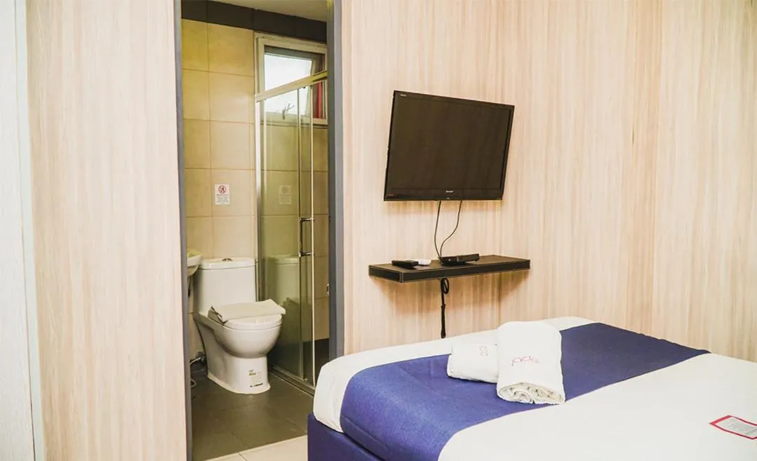 Bed in Jade Hotel and Suites